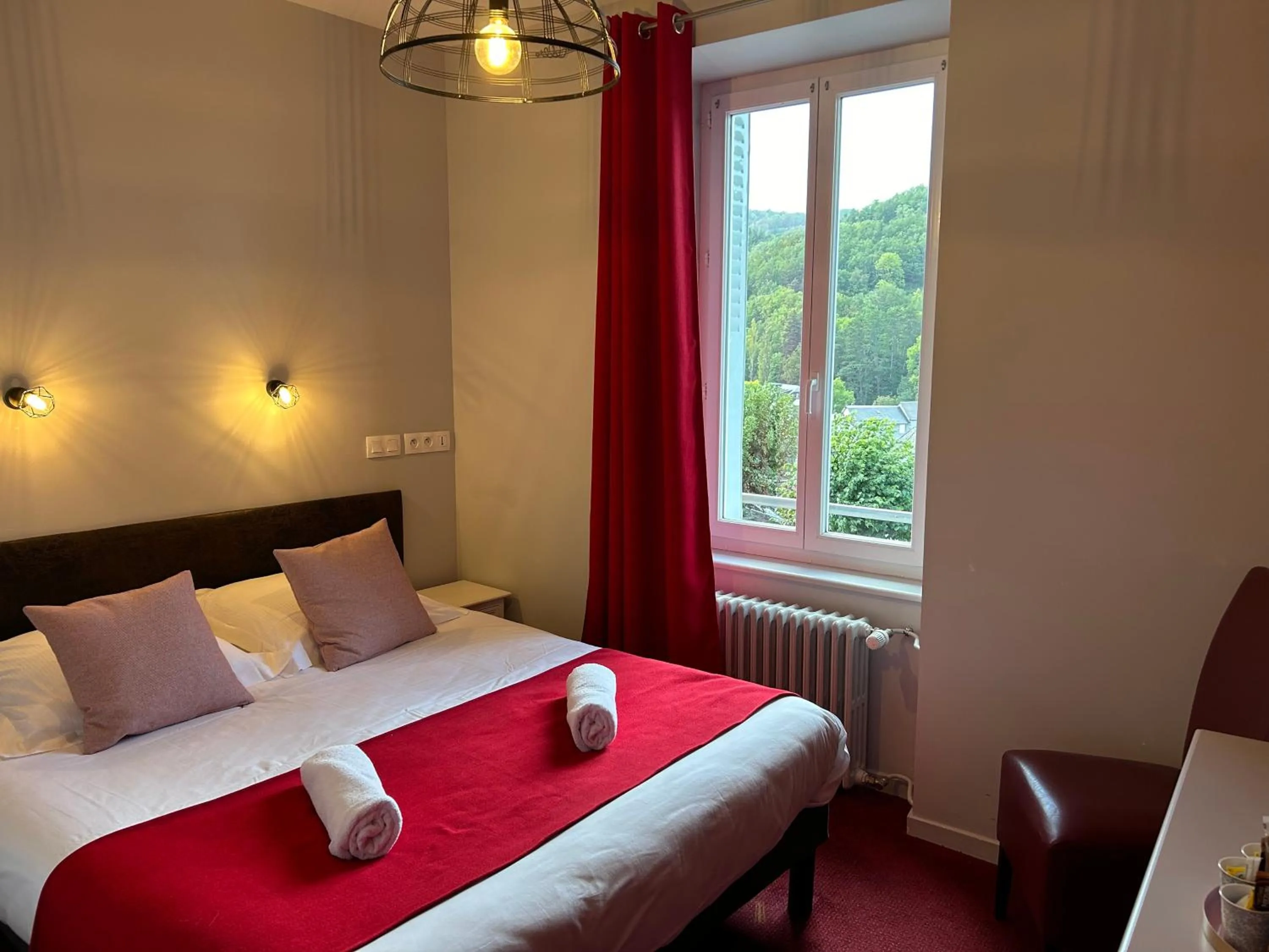 Bed in Logis Hôtel de Paris