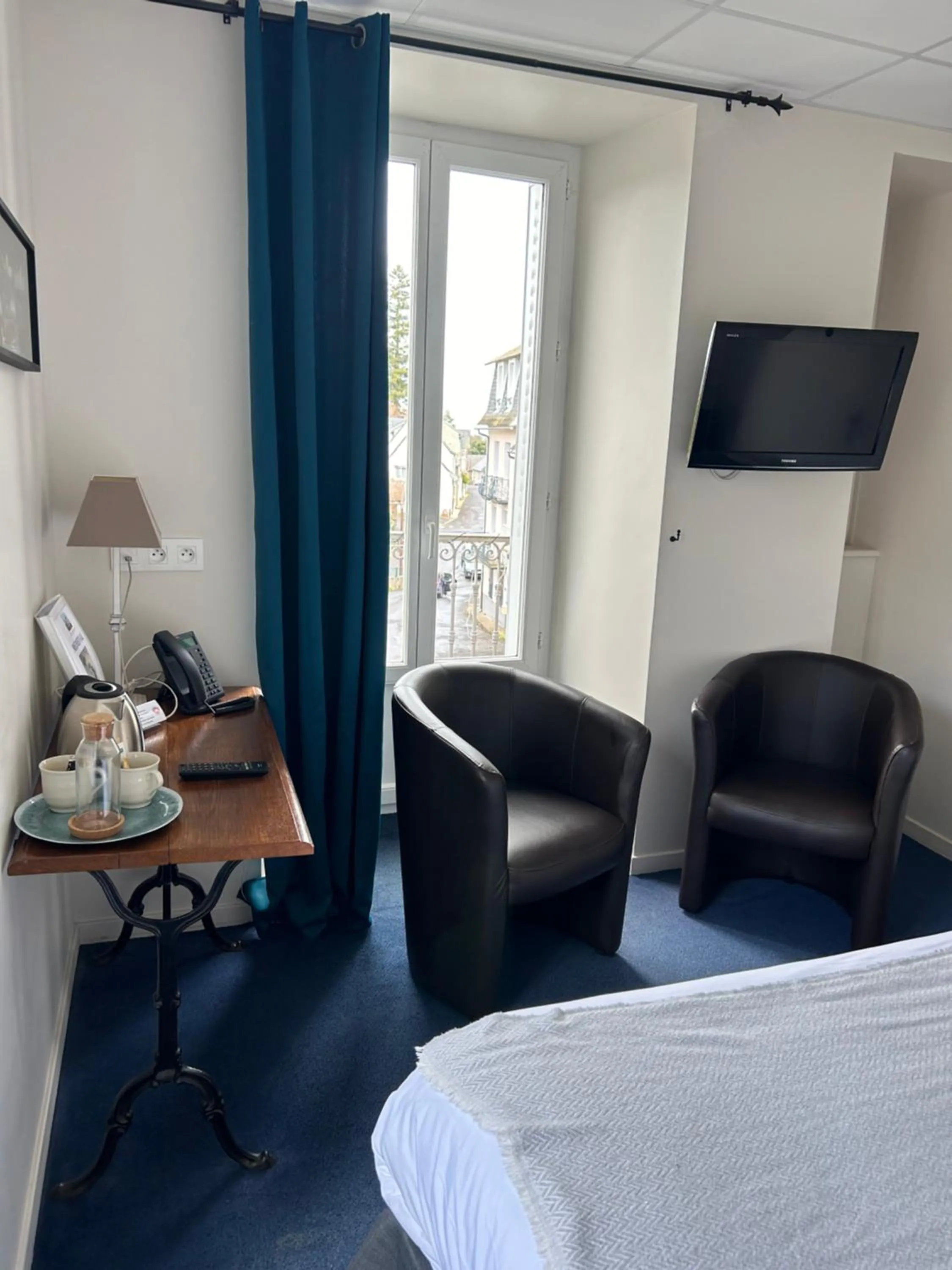 Bed in Logis Hôtel de Paris