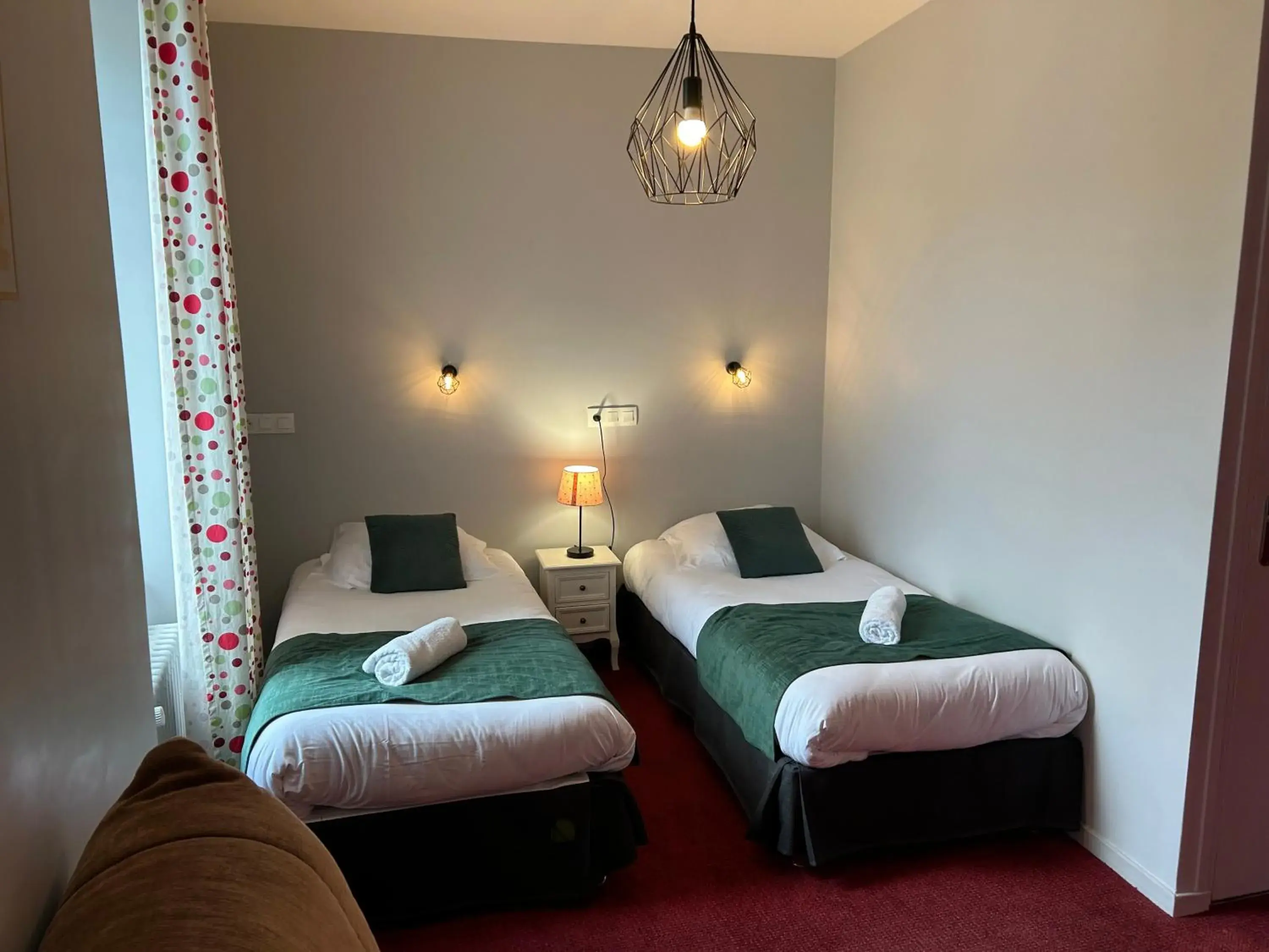 Bed in Logis Hôtel de Paris Bed in Logis Hôtel de Paris