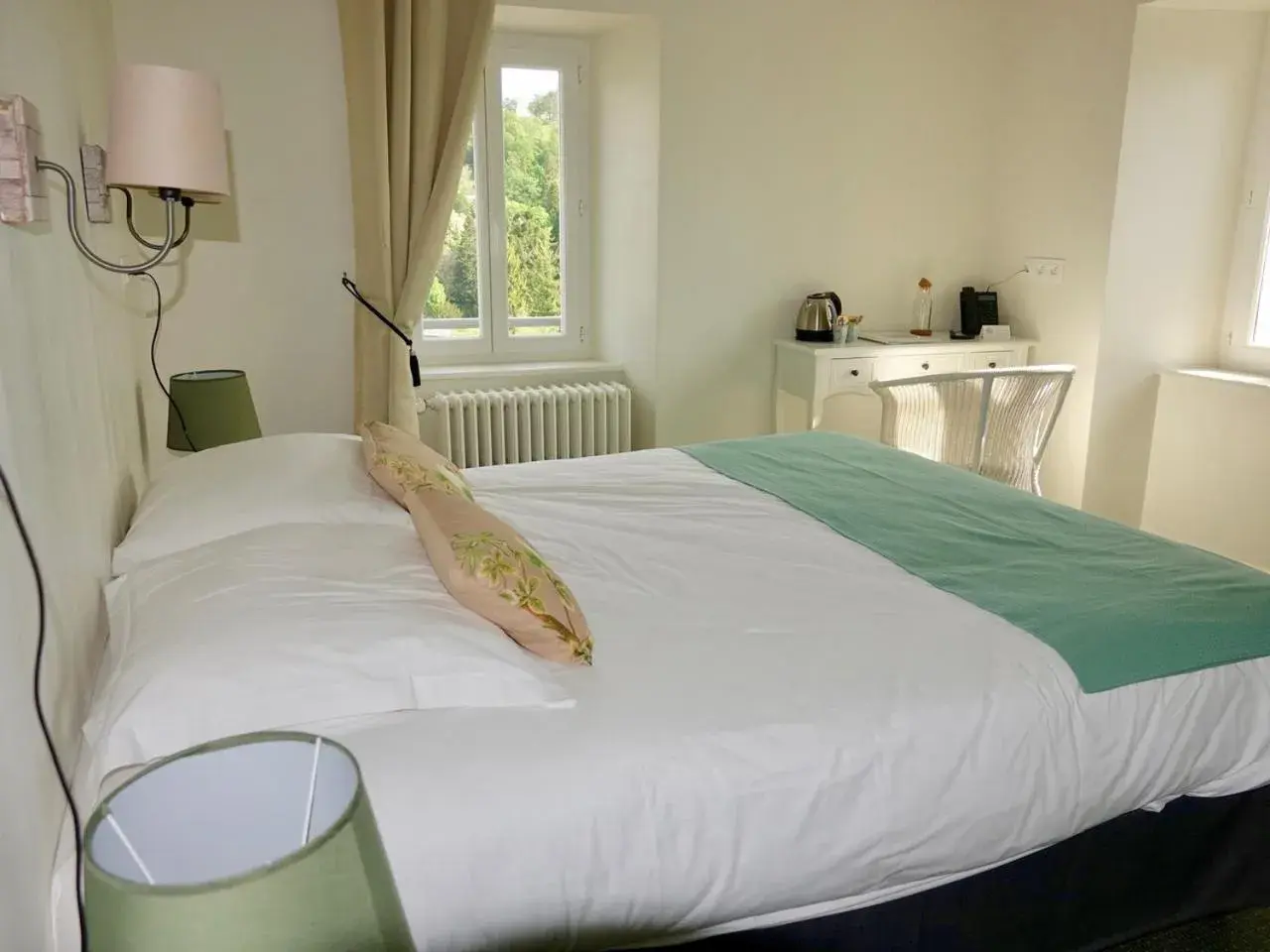 Bed in Logis Hôtel de Paris Bed in Logis Hôtel de Paris