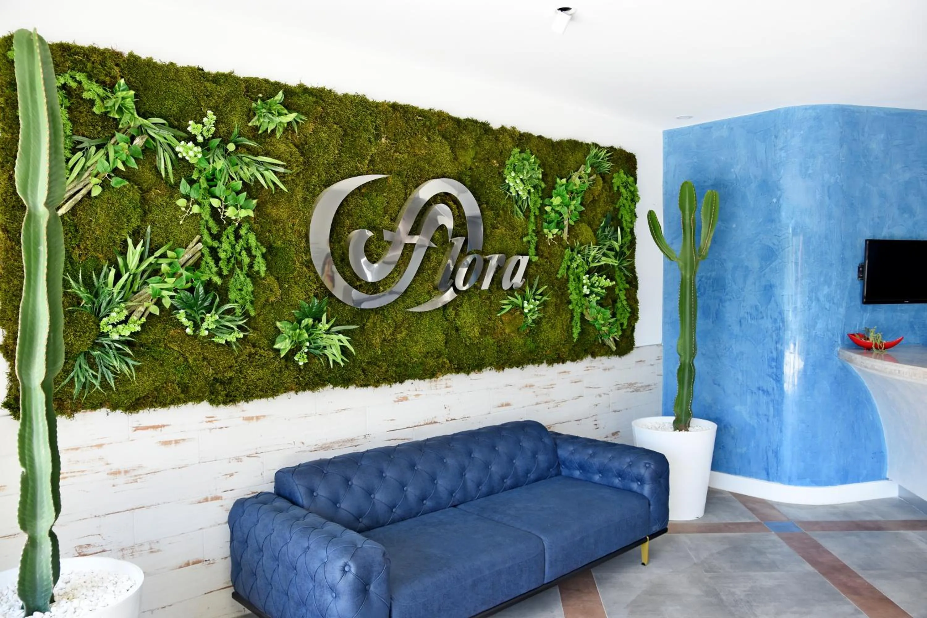 Property logo or sign in Flora Hotel