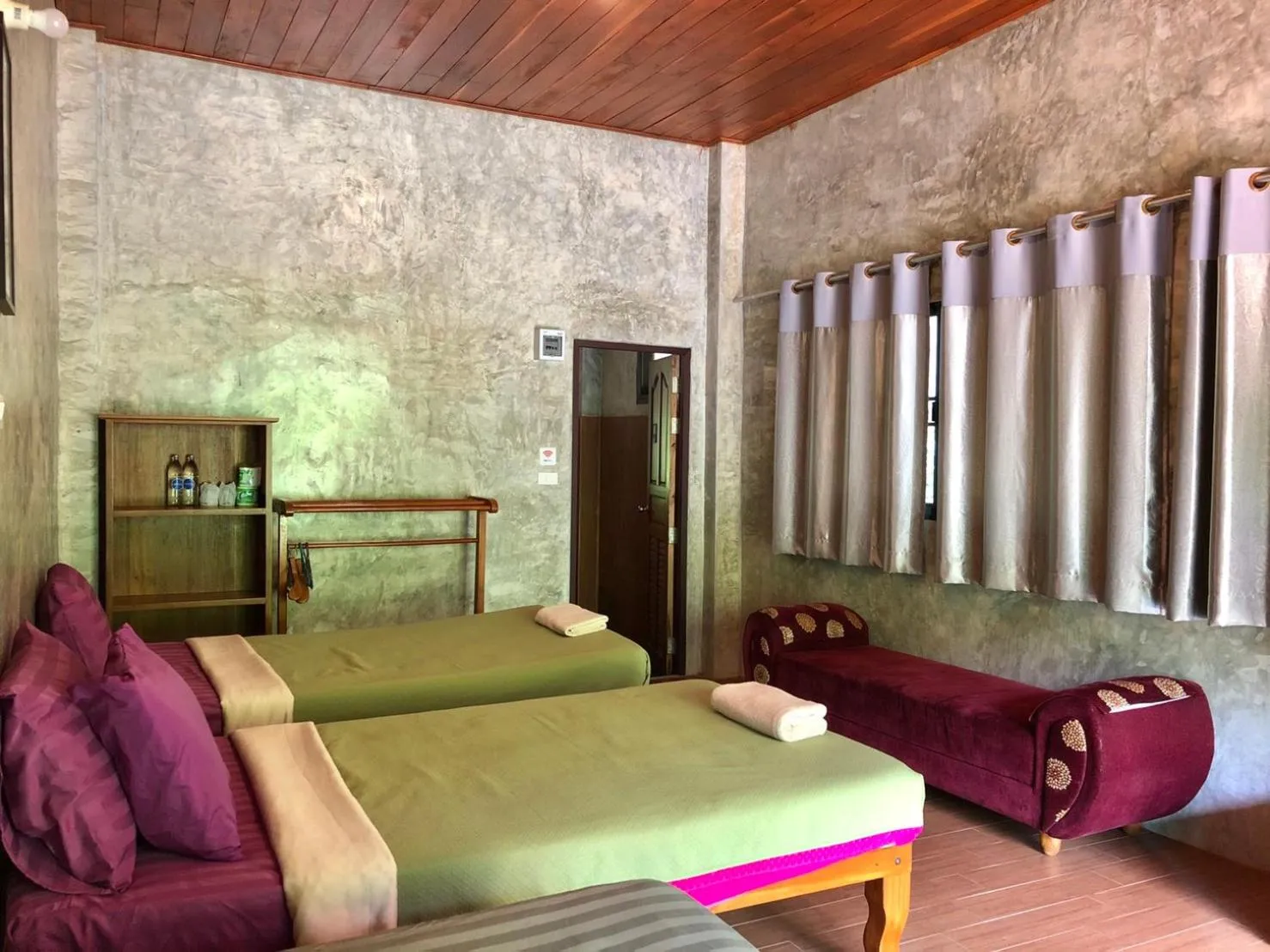 Bed in Maewin Guesthouse and Resort