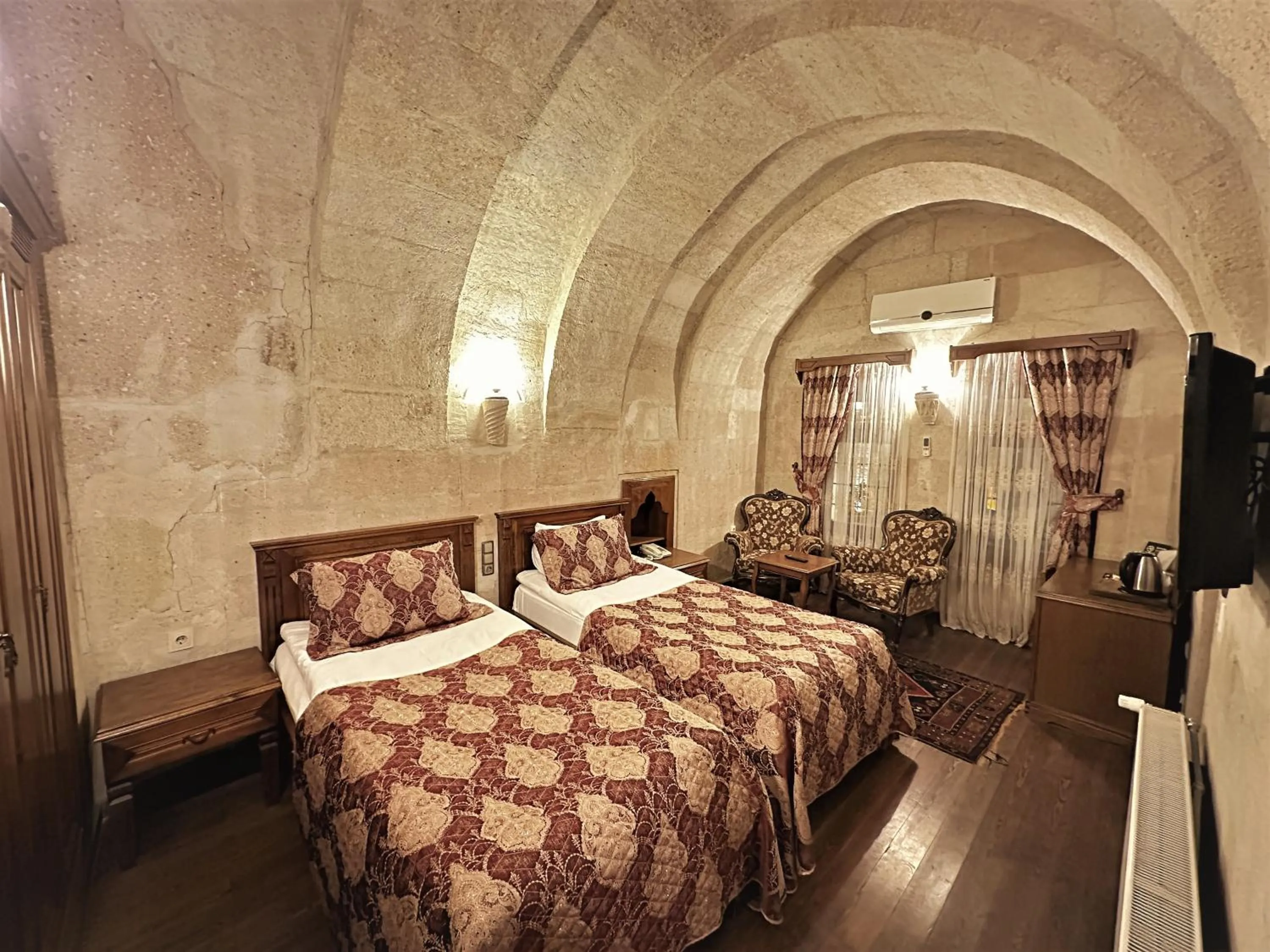 Bed in Stone House Cave Hotel
