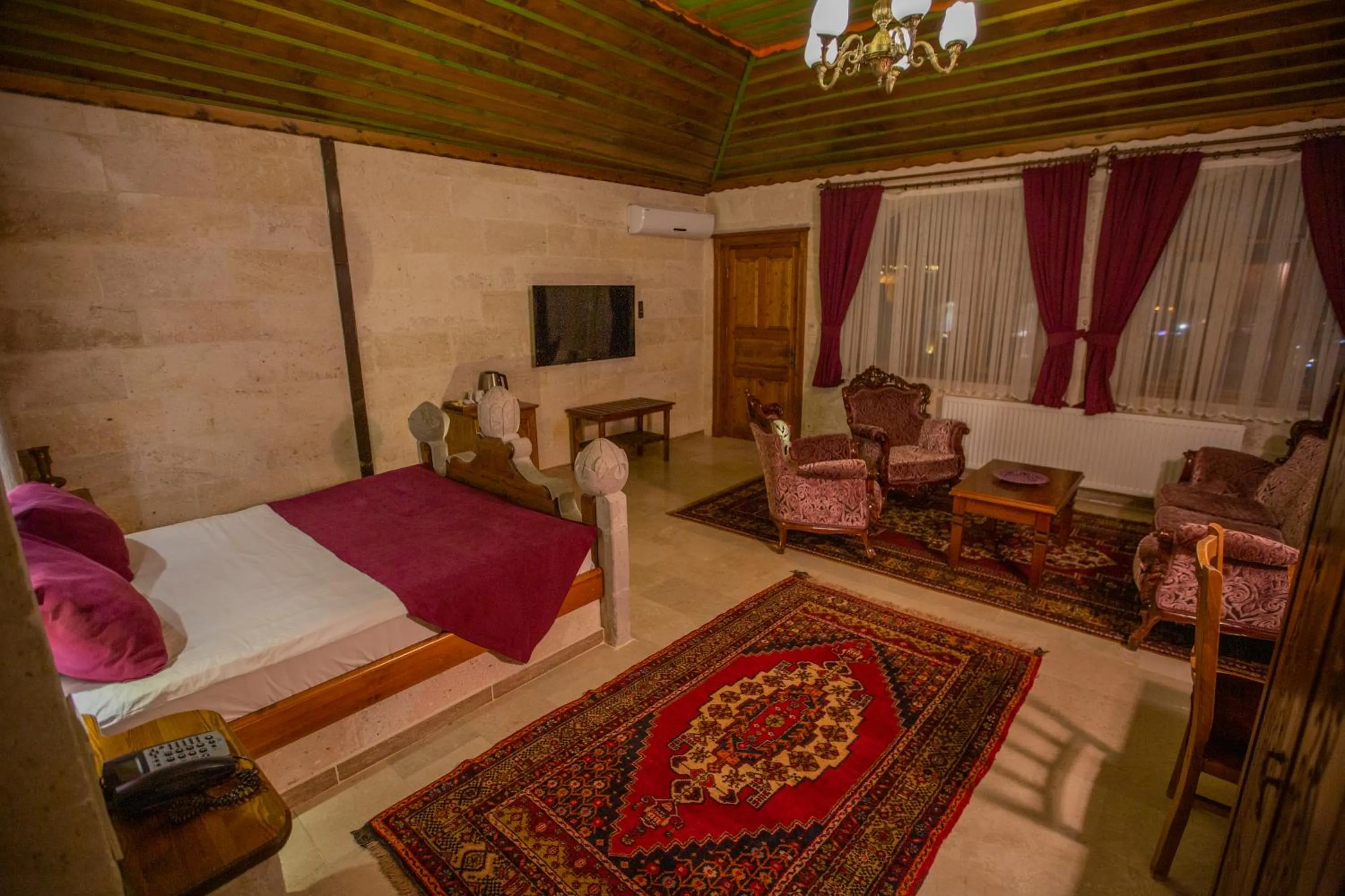 Bed in Stone House Cave Hotel