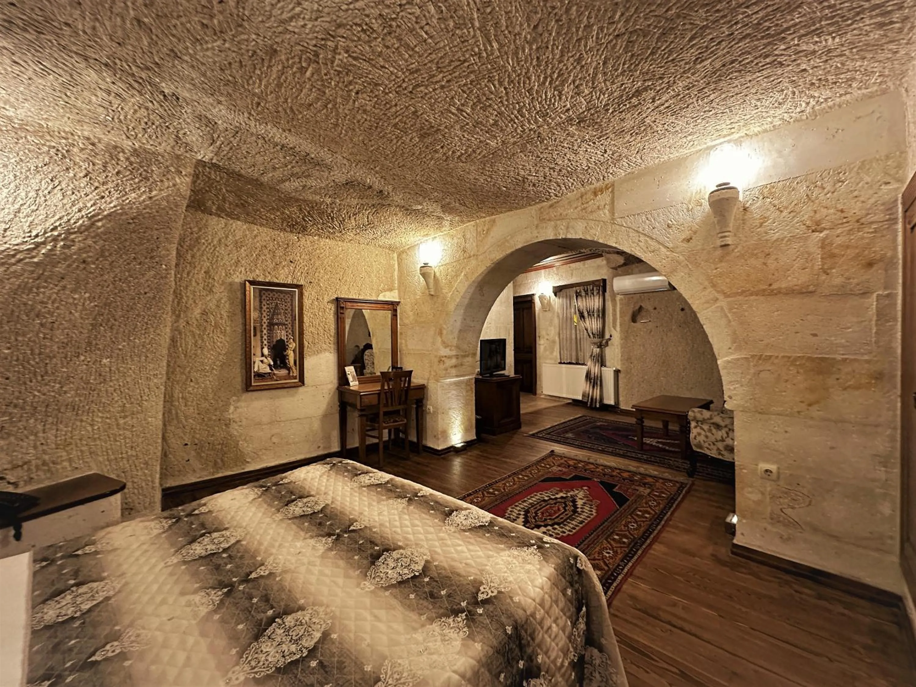 Bed in Stone House Cave Hotel
