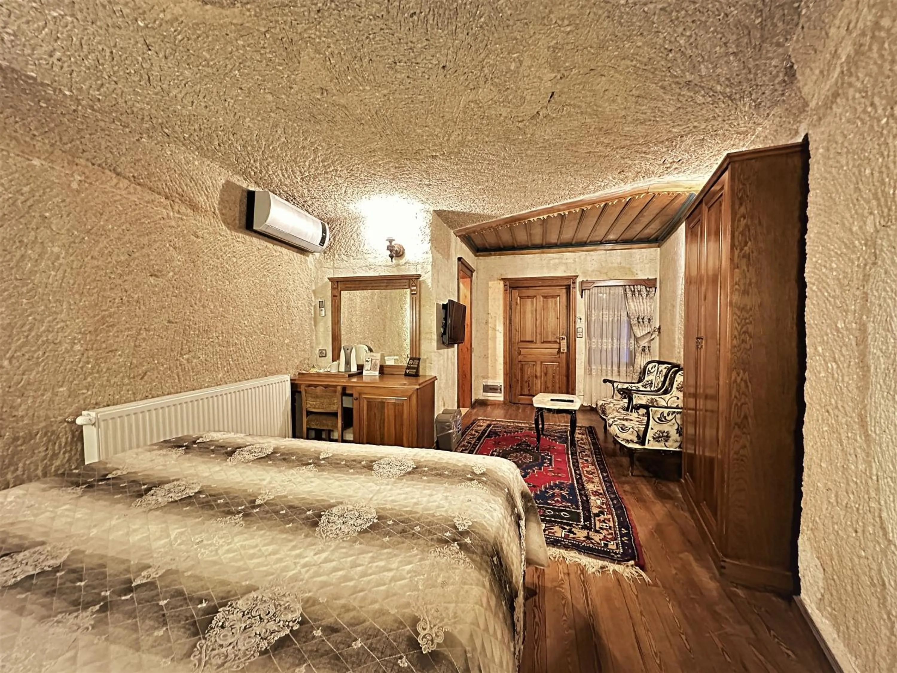 Bed in Stone House Cave Hotel