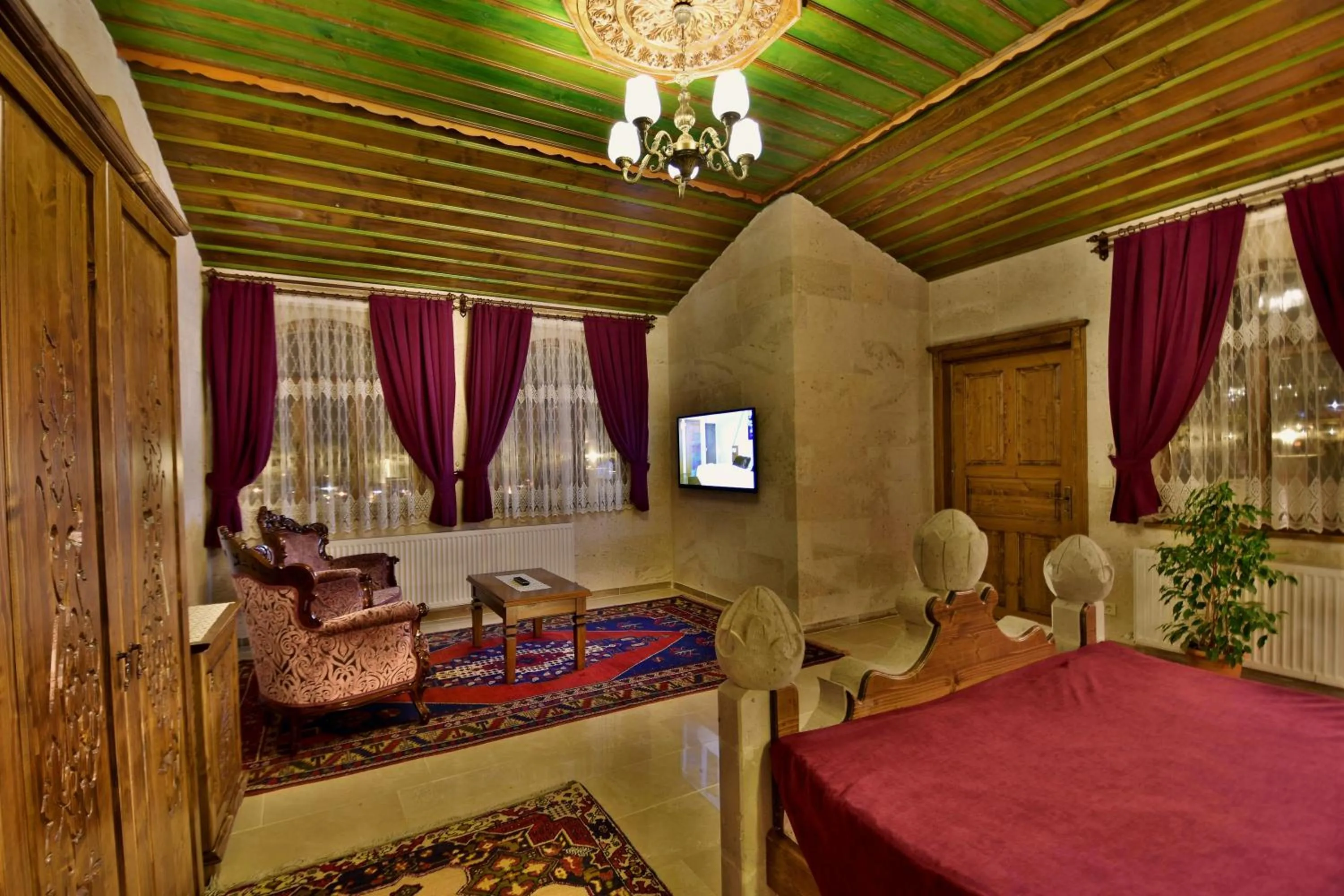 Photo of the whole room, Bed in Stone House Cave Hotel