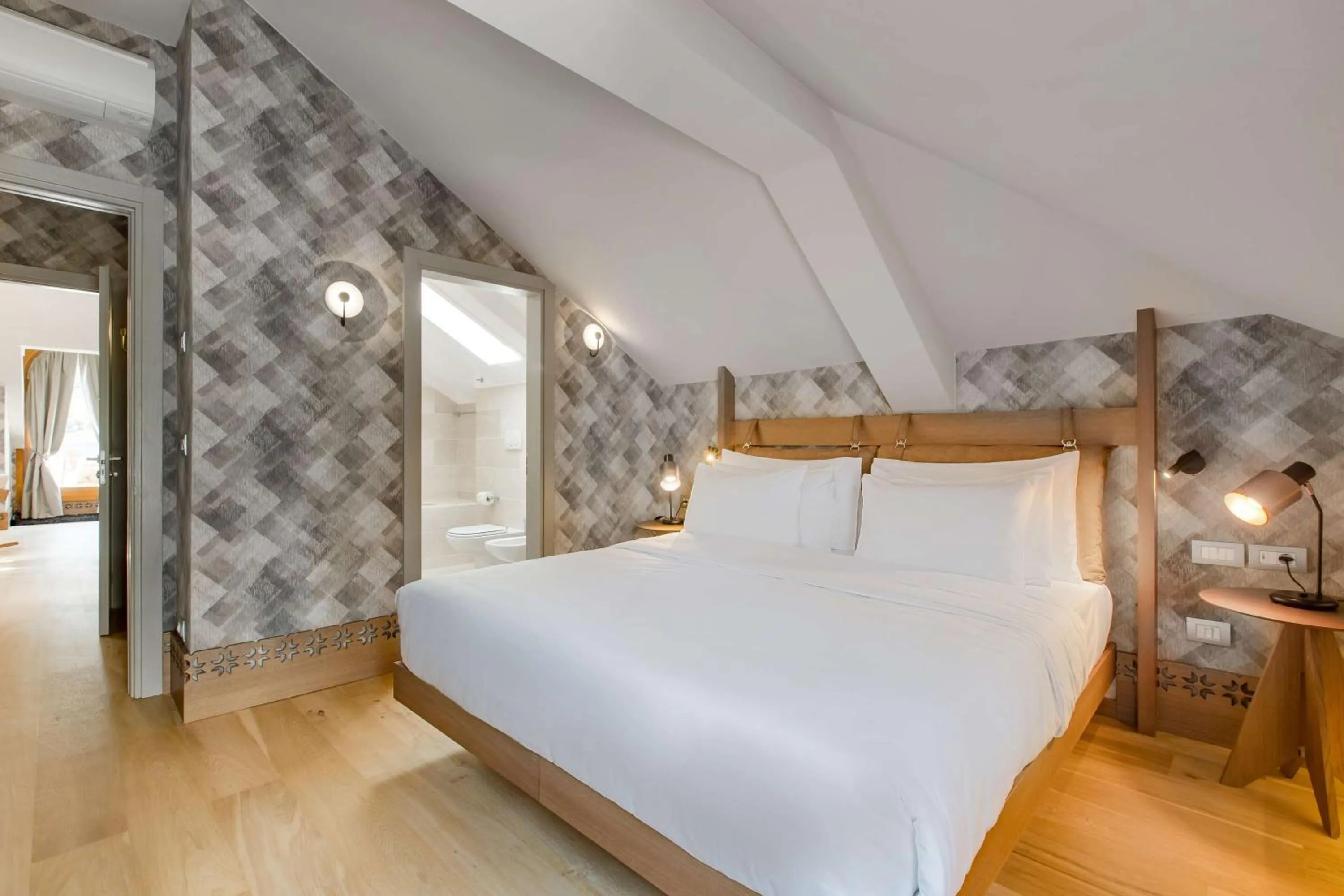 Photo of the whole room, Bed in Grand Hotel Savoia Cortina d'Ampezzo, A Radisson Collection Hotel