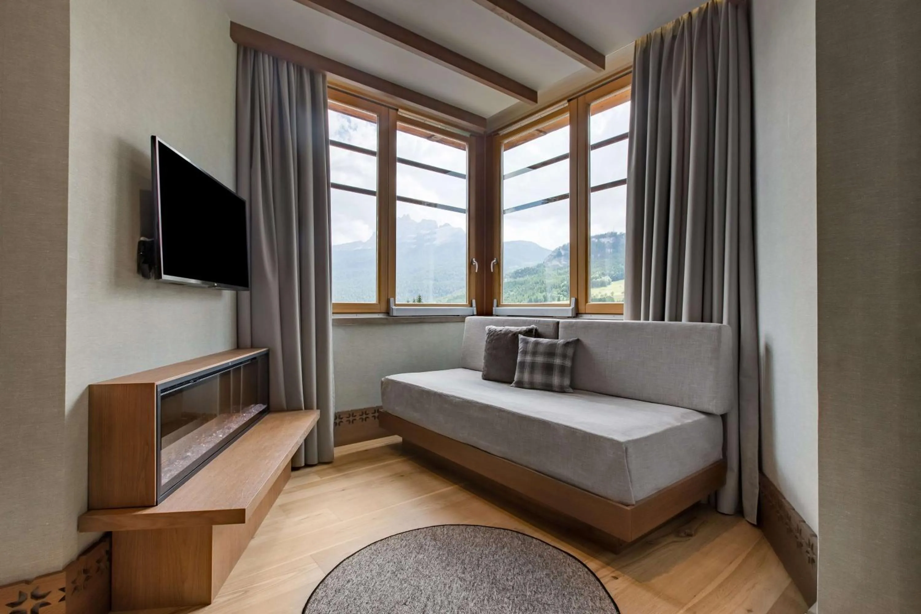 Living room, Bed in Grand Hotel Savoia Cortina d'Ampezzo, A Radisson Collection Hotel