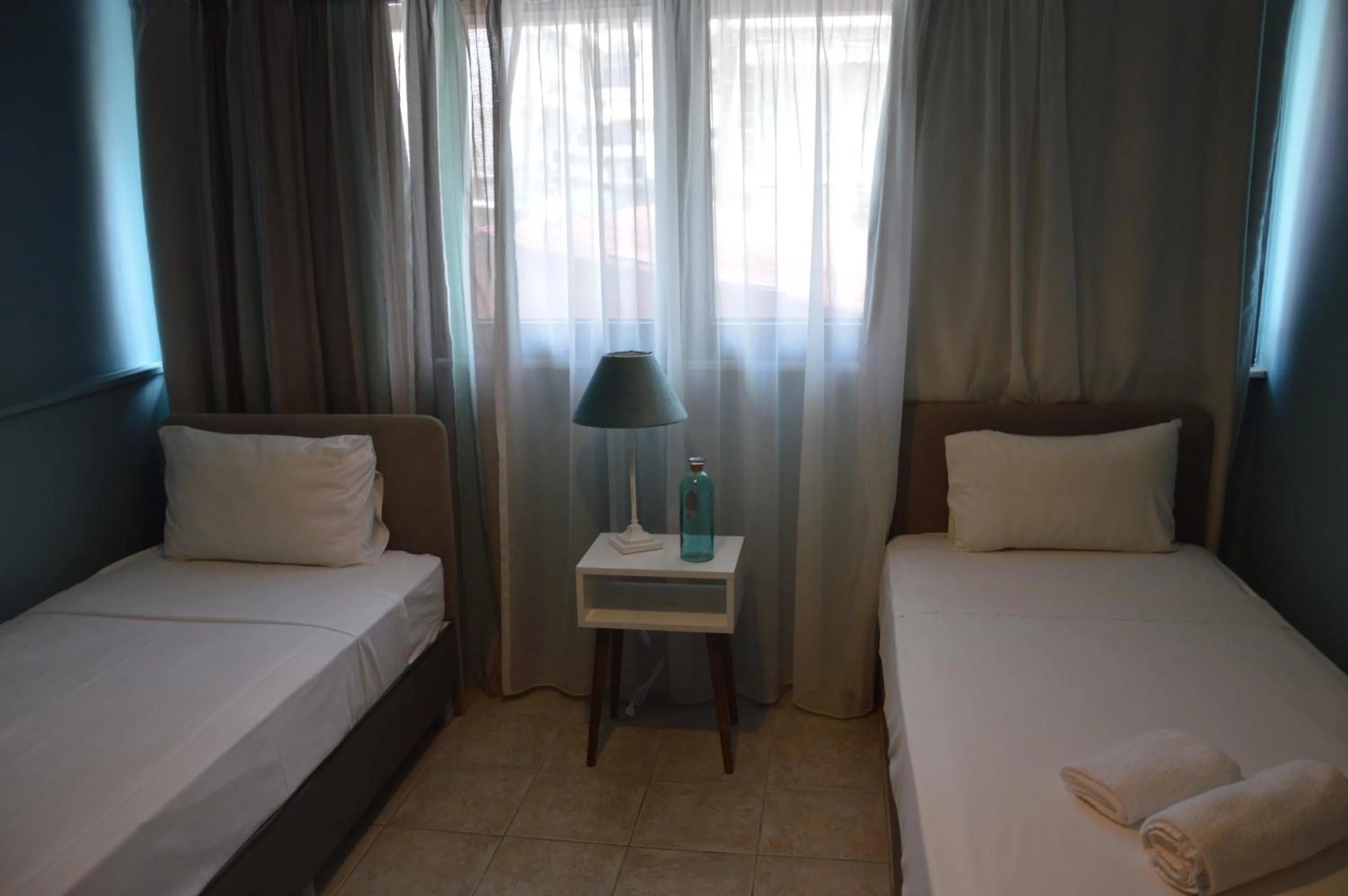 Bed in Aqua Mare Sea Side Rooms