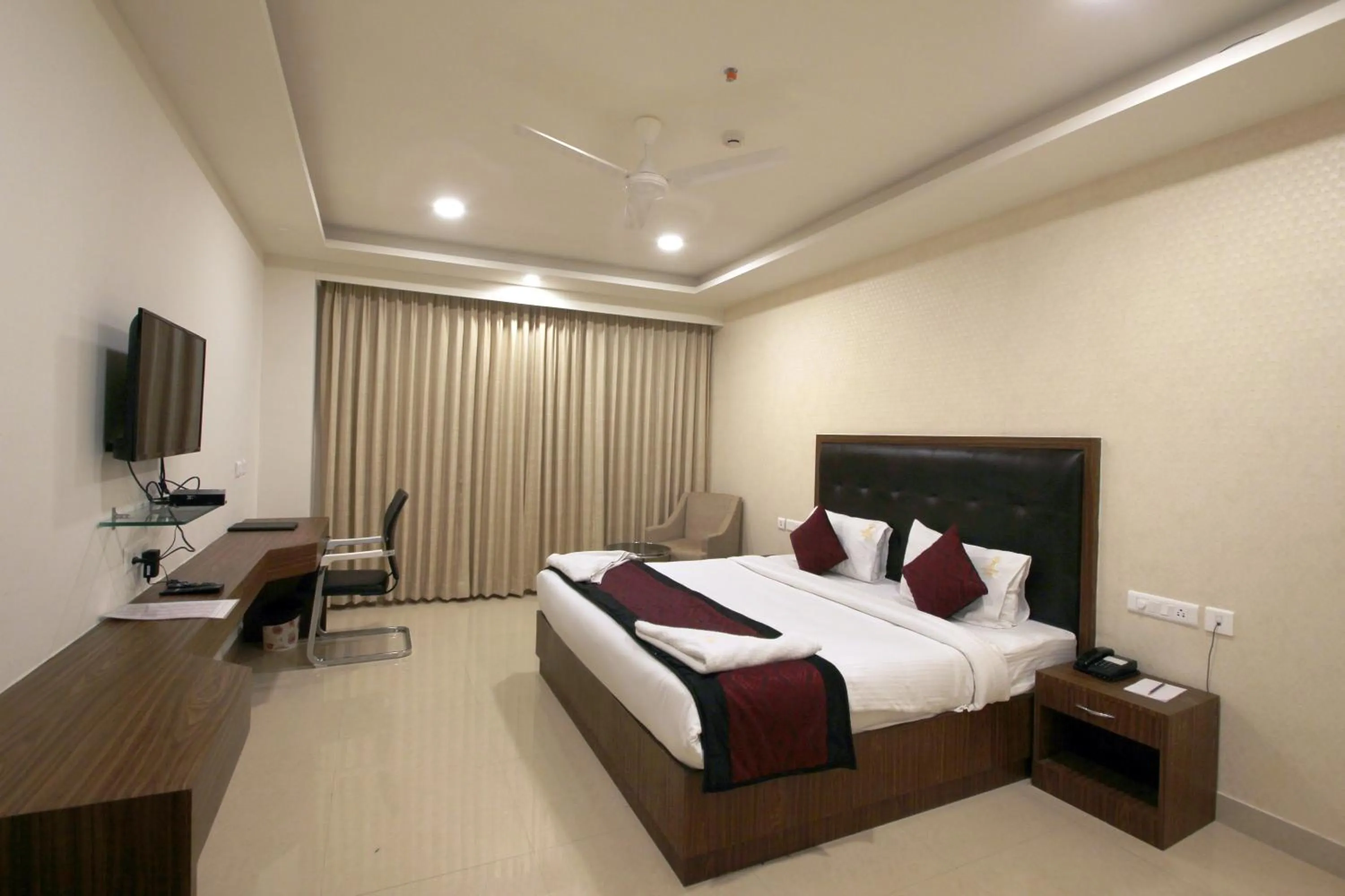 Bed in Hotel Hyderabad Grand