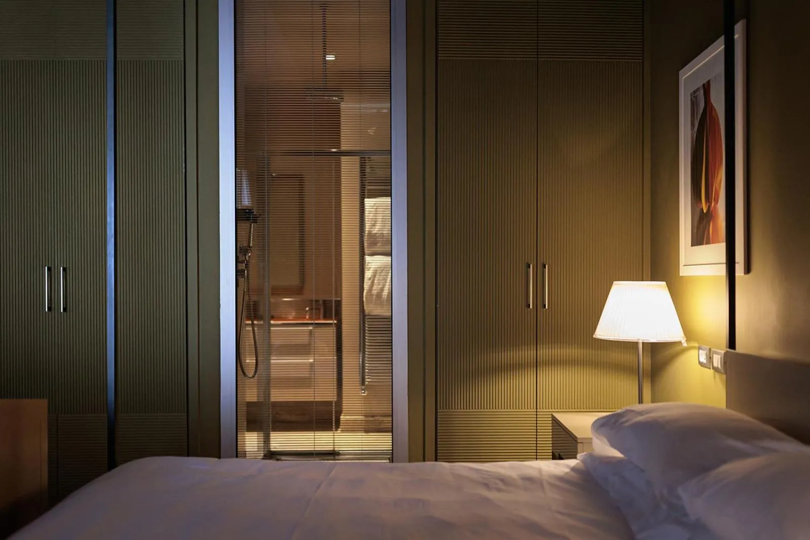 Bed in Escalus Luxury Suites Verona