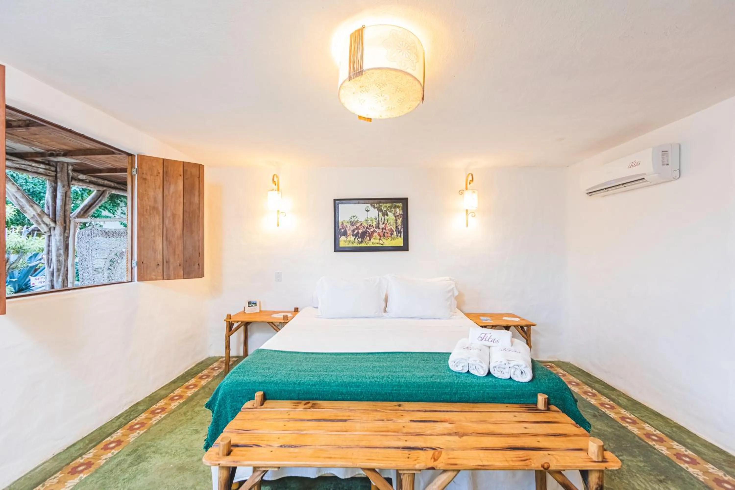 Bed in Pousada Titas