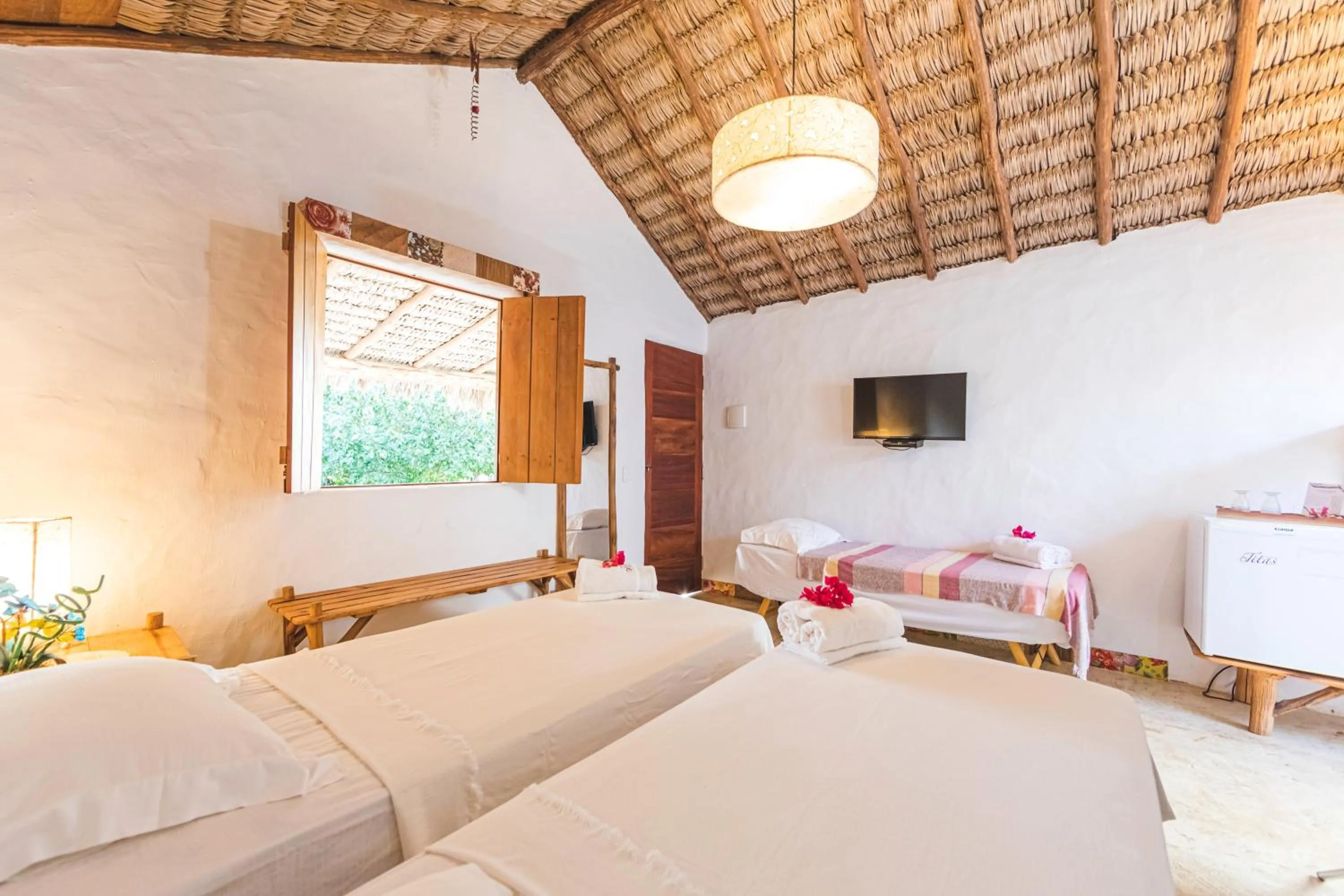 Bed in Pousada Titas