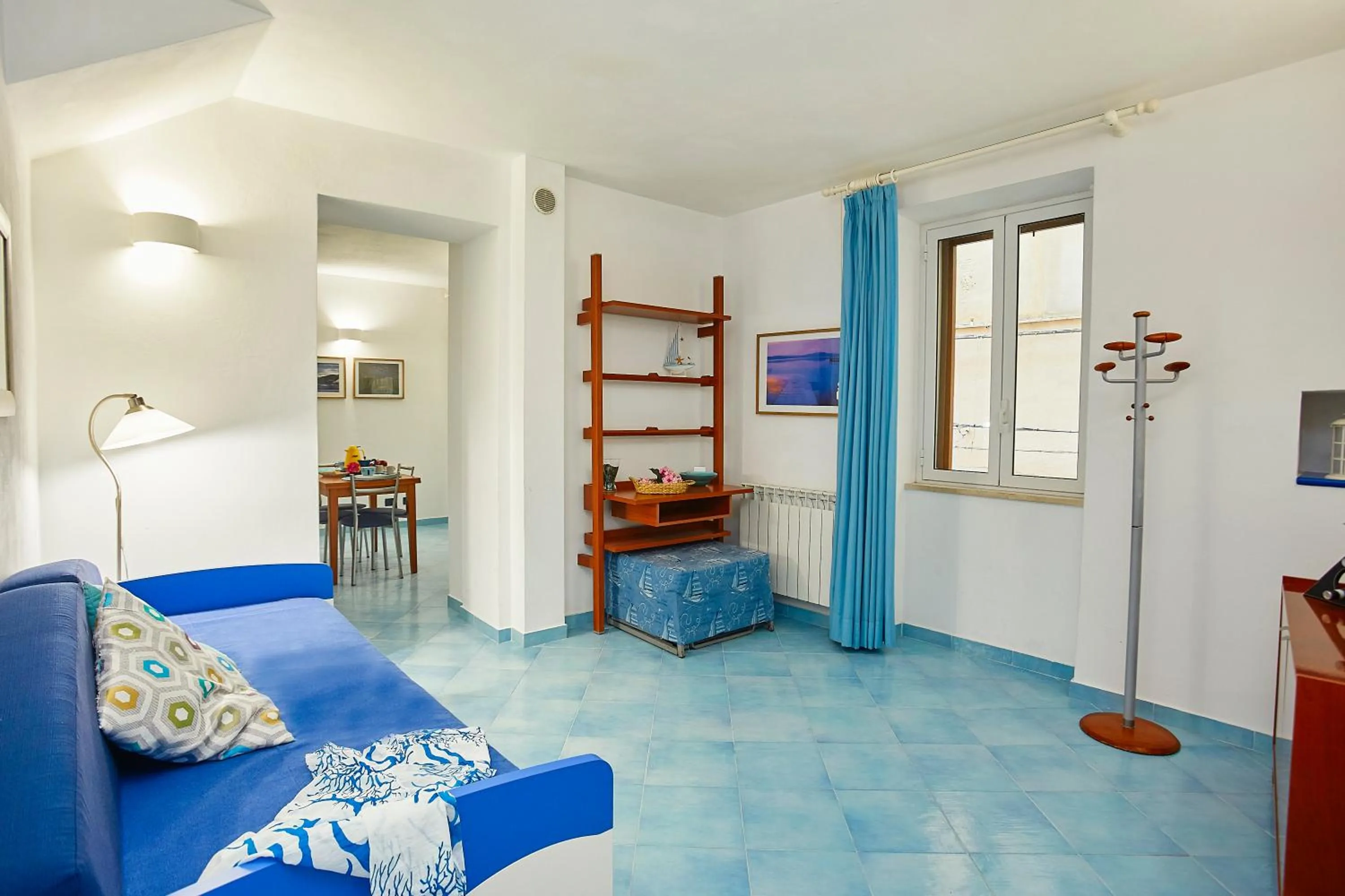 Living room, Bed in Appartamenti Rosa Dei Venti