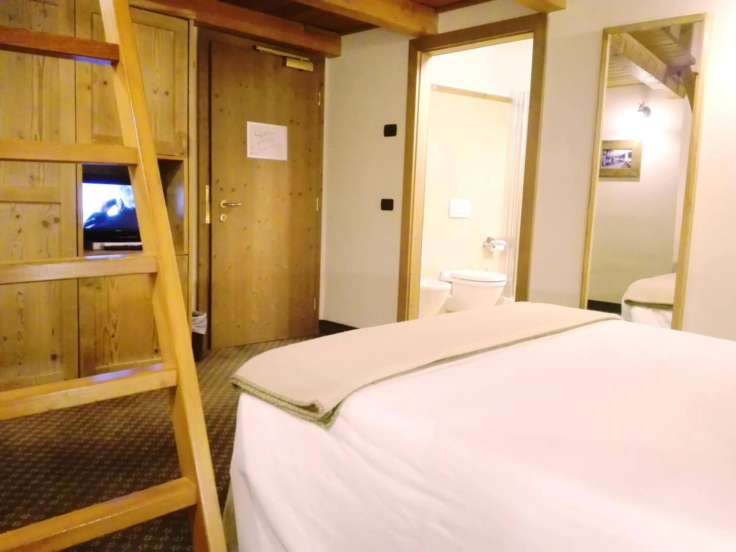 Bed in Le Miramonti Hotel Restaurant & Wellness