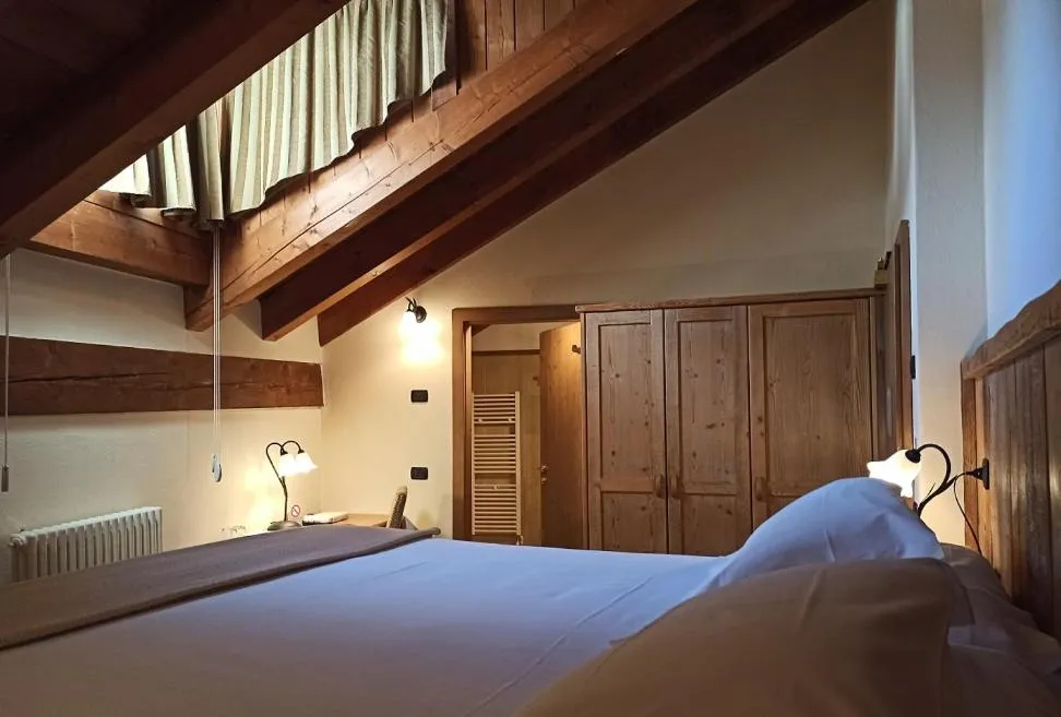 Bed in Le Miramonti Hotel Restaurant & Wellness