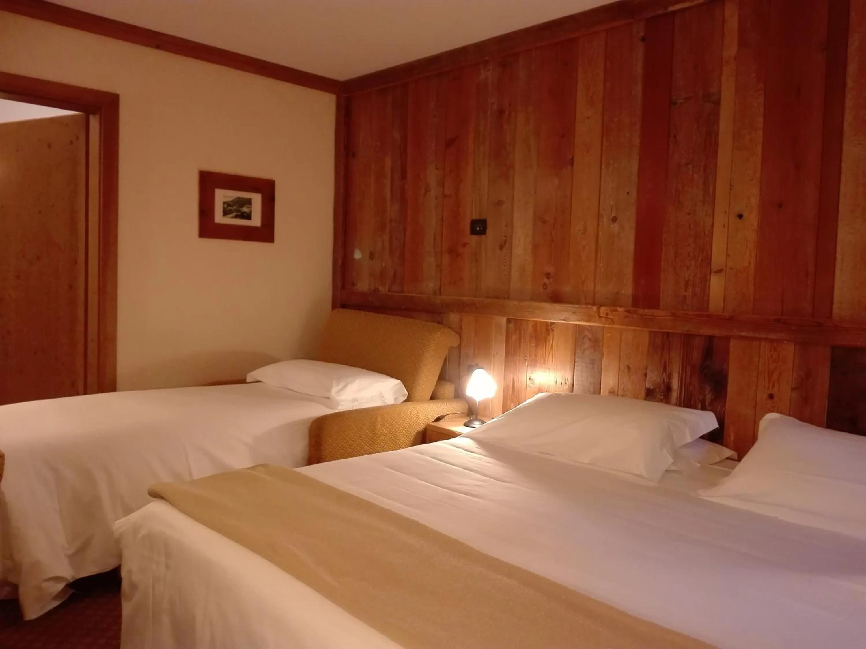 Bed in Le Miramonti Hotel Restaurant & Wellness