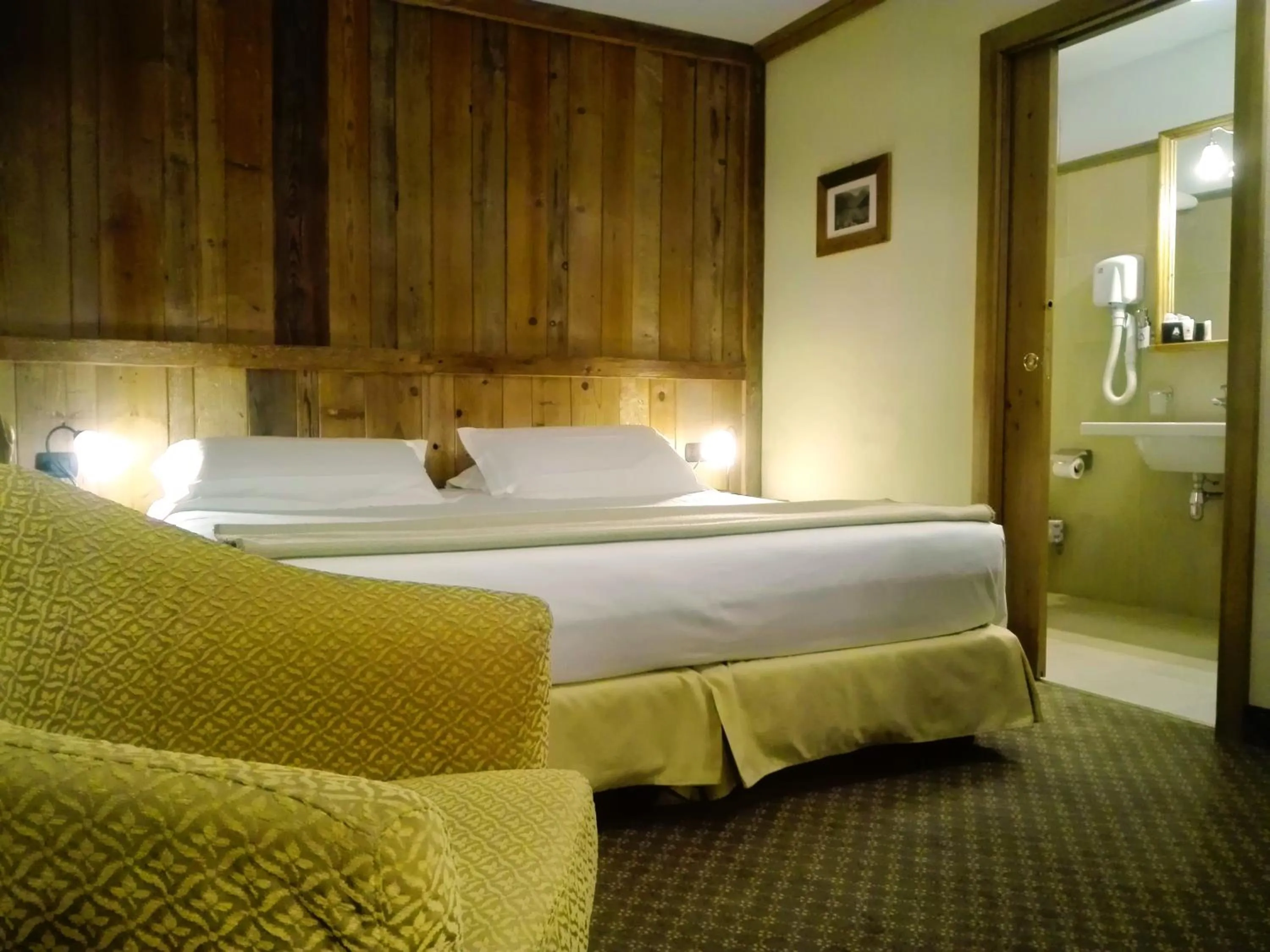 Bed in Le Miramonti Hotel Restaurant & Wellness