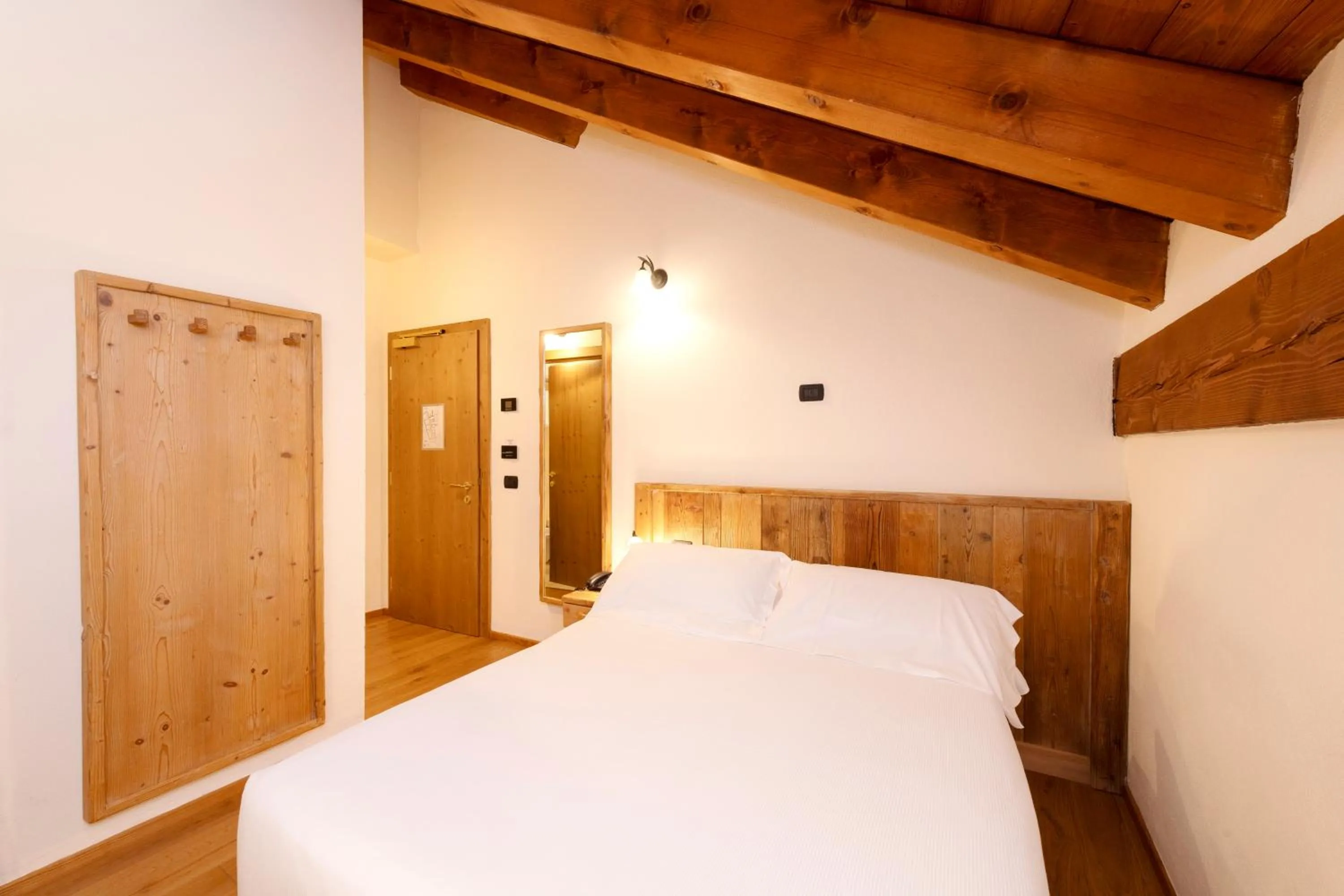 Bed in Le Miramonti Hotel Restaurant & Wellness