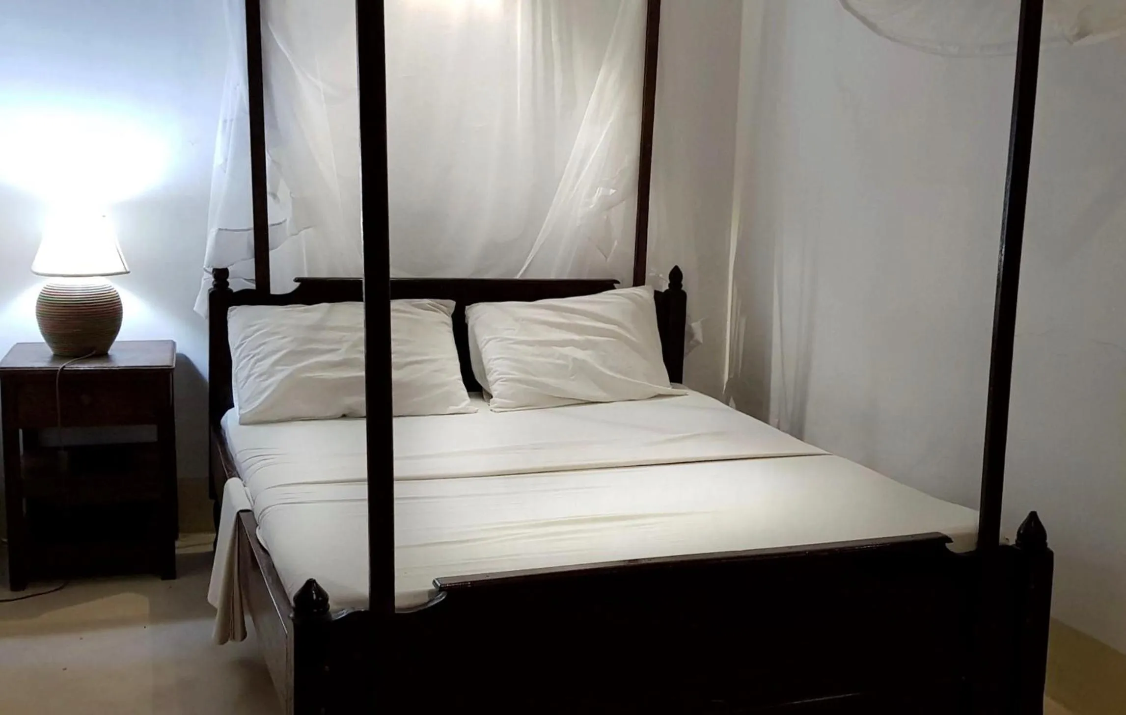 Bed in Menai Bay Beach Bungalows