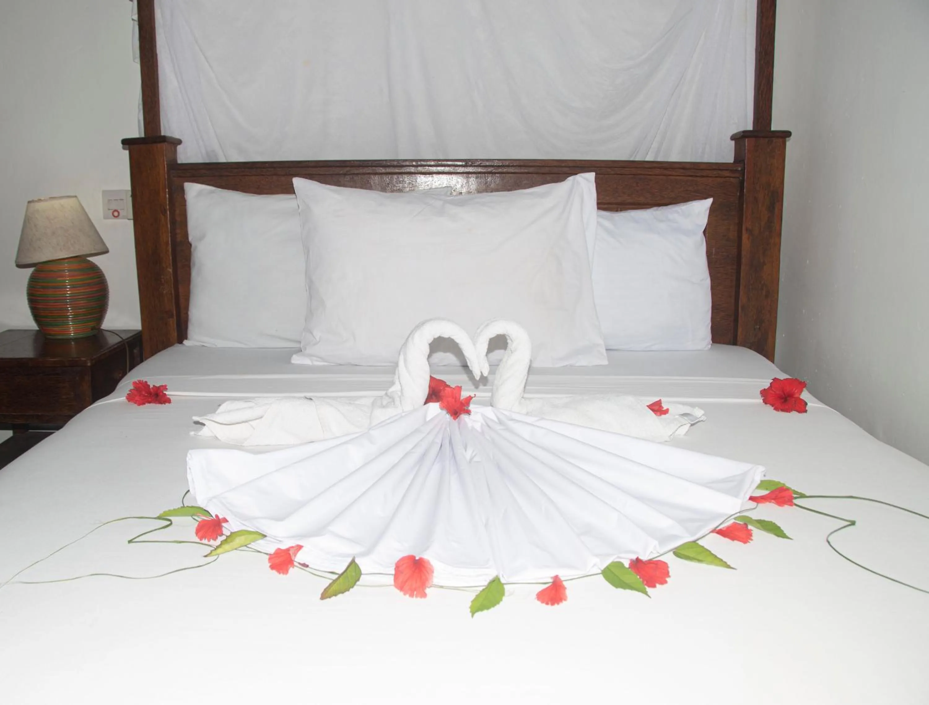 Bed in Menai Bay Beach Bungalows