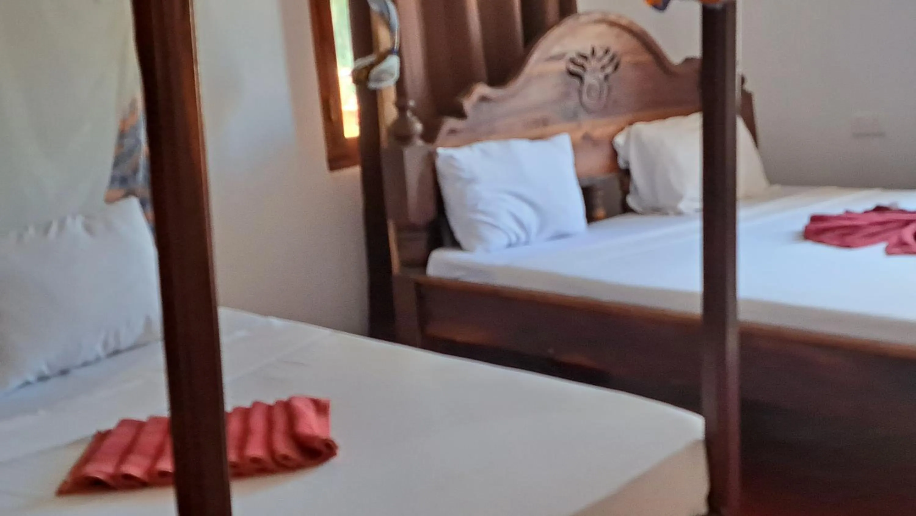 Bed in Menai Bay Beach Bungalows