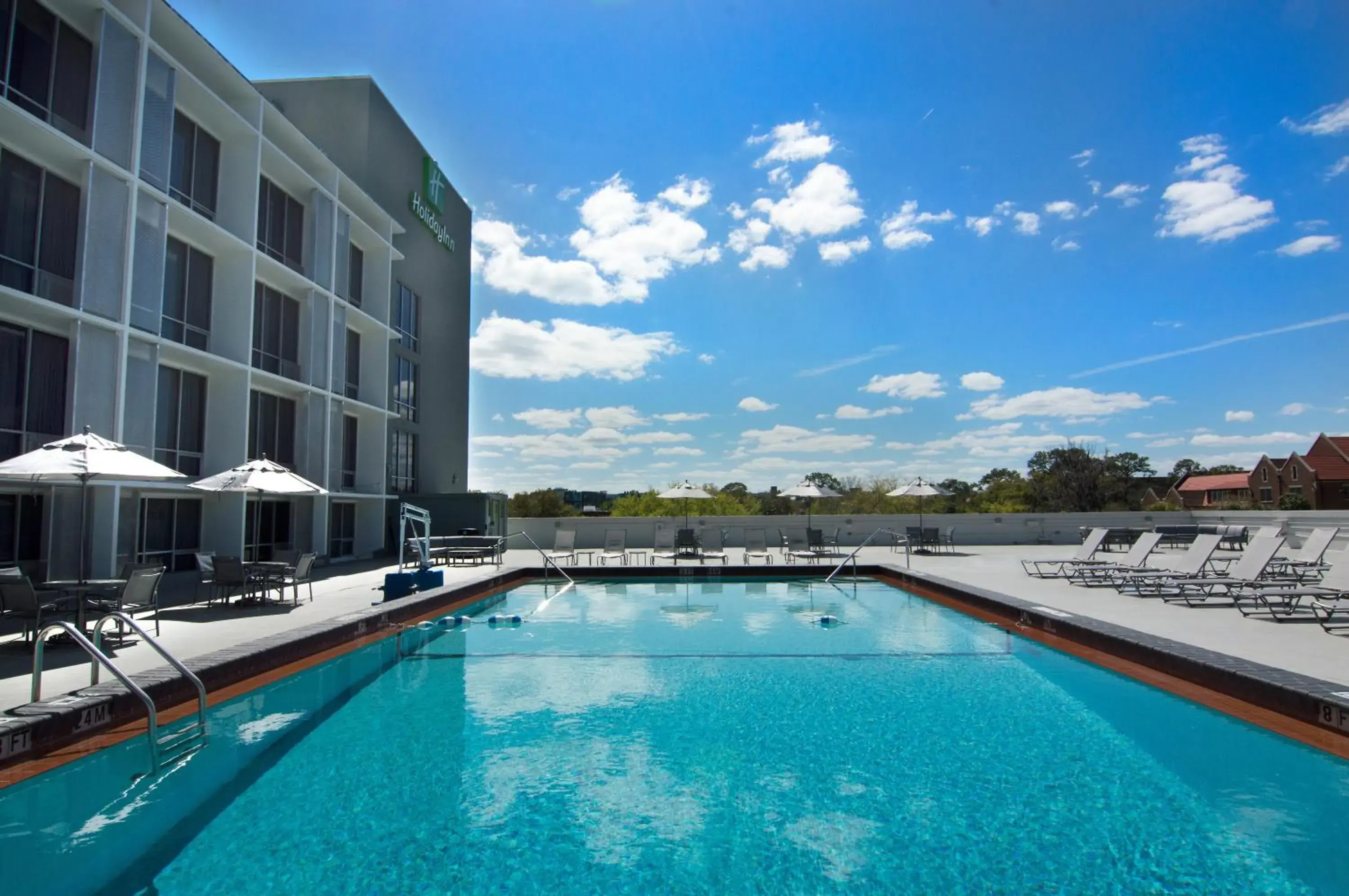 Swimming pool in Holiday Inn Gainesville-University Center by IHG Swimming pool in Holiday Inn Gainesville-University Center by IHG