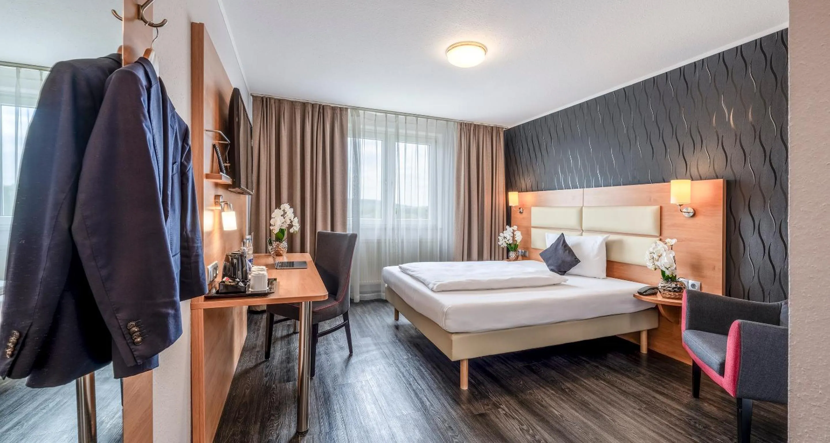 Bed in PLAZA INN Stuttgart Airport Messe