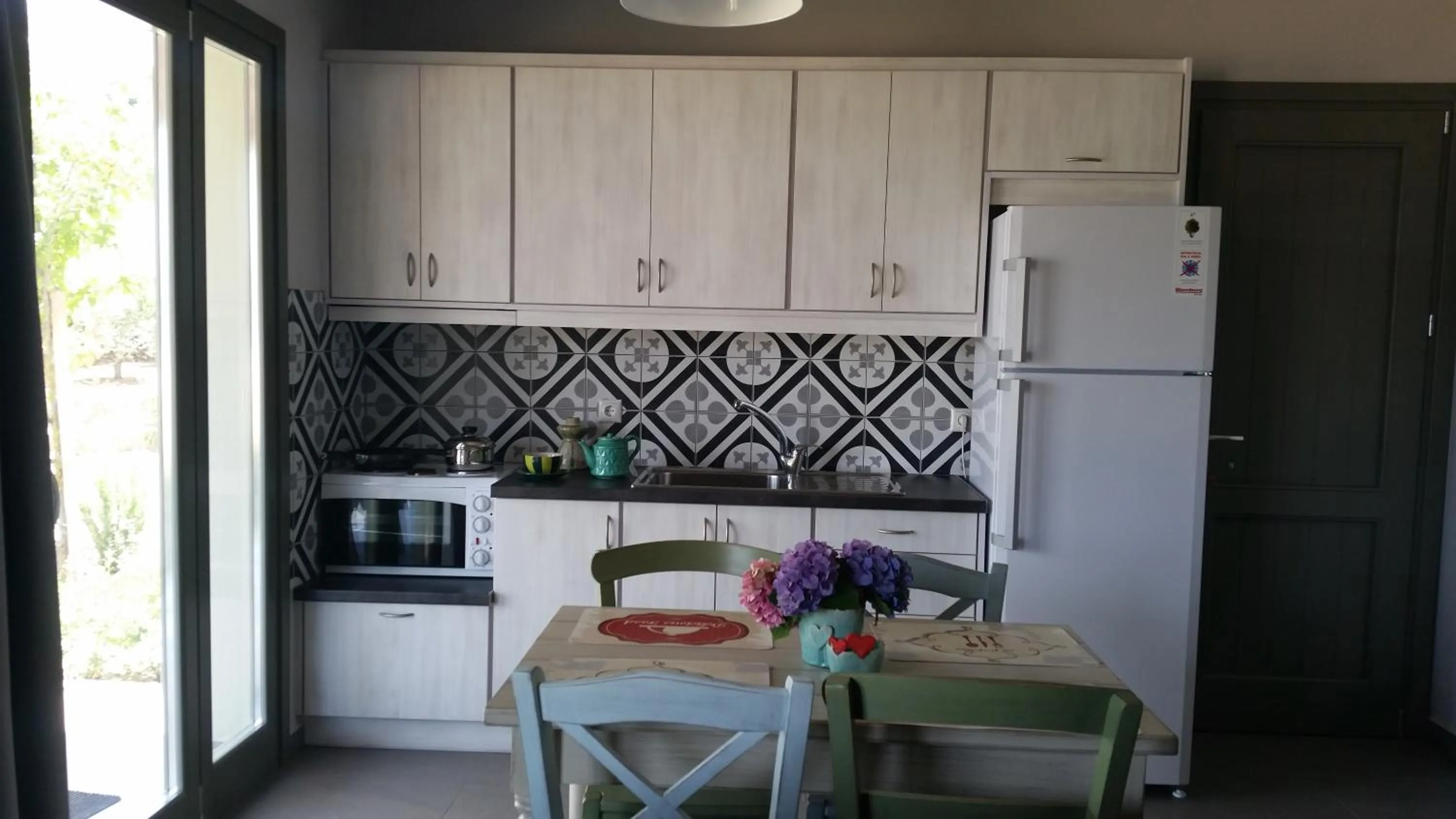 Kitchen or kitchenette in Thea Houses