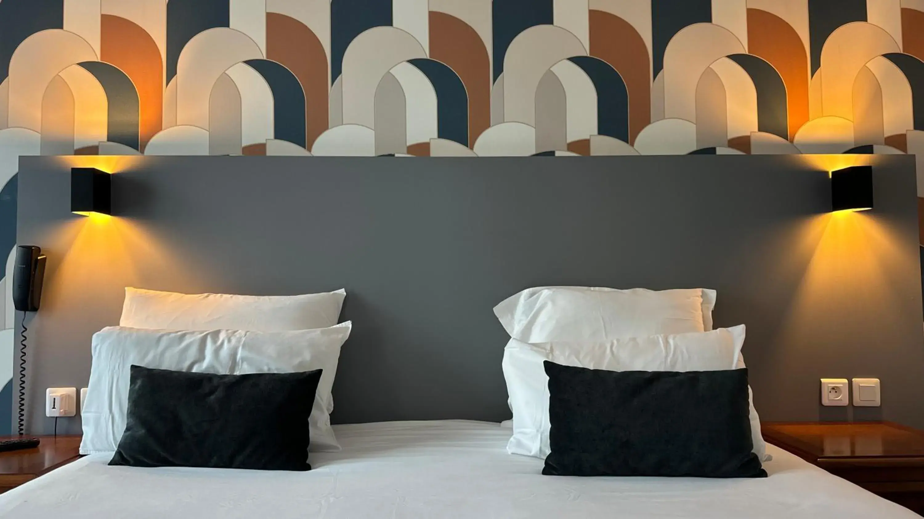 Bed in Hotel Le Bourgogne Bed in Hotel Le Bourgogne