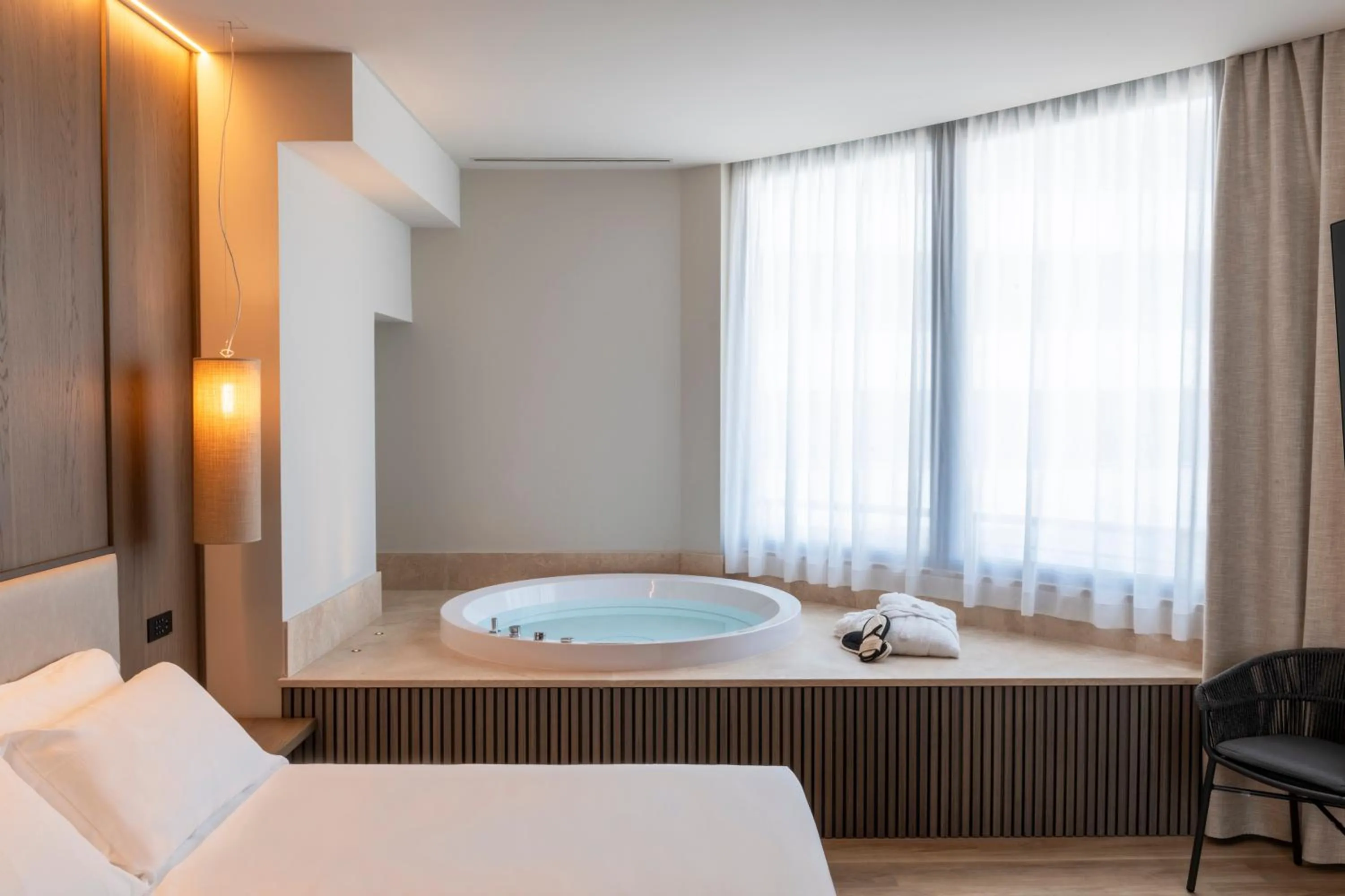 Bath, Bed in International Hotel & Suite