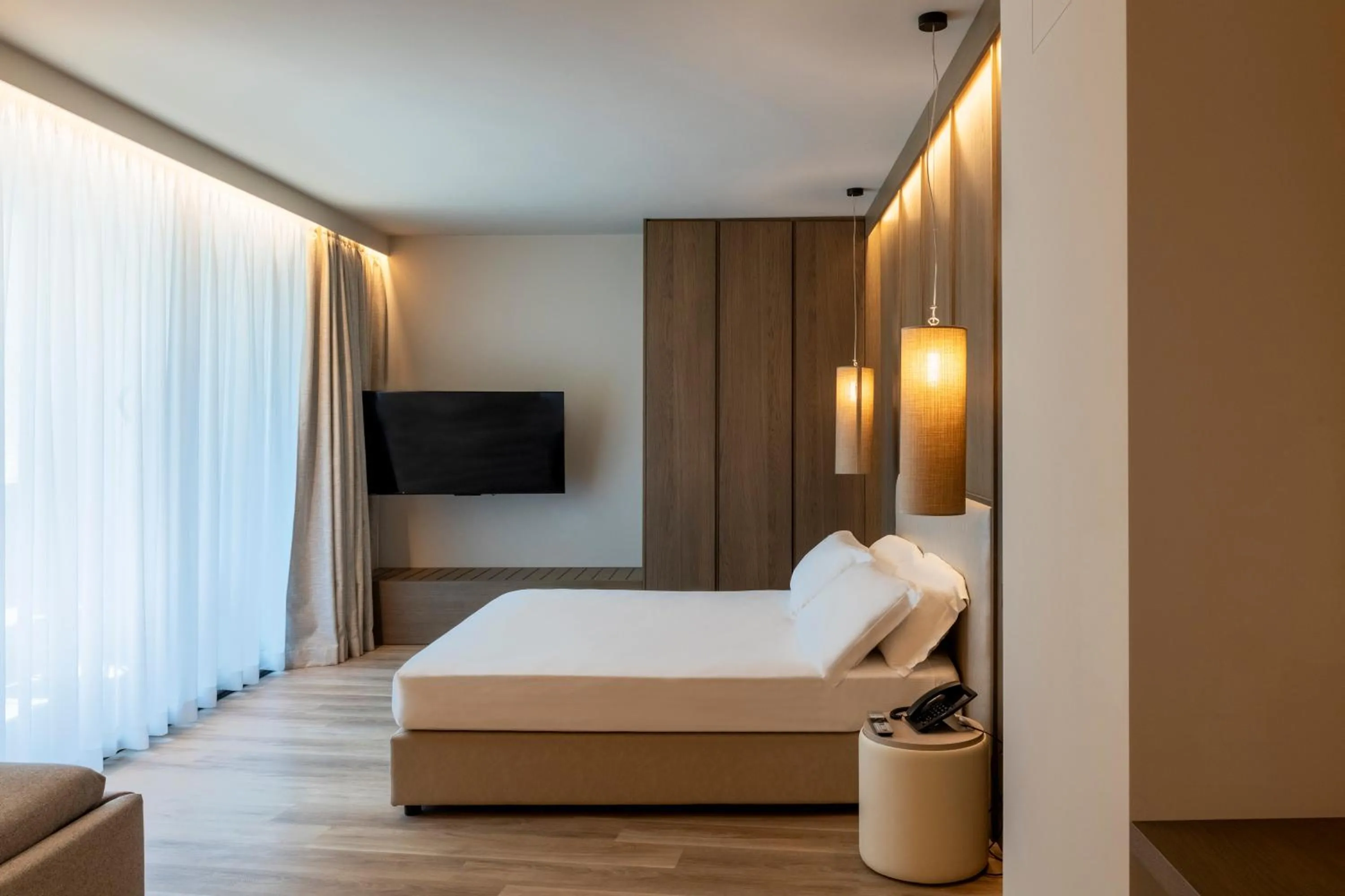 Bed in International Hotel & Suite