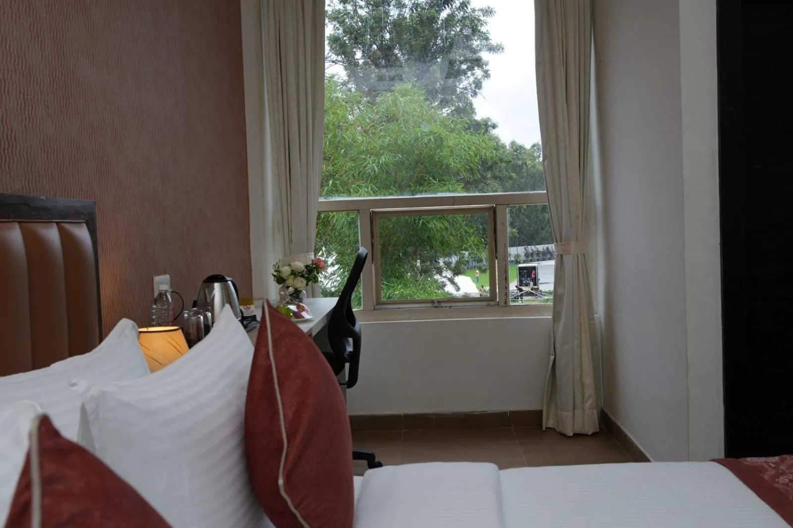 View (from property/room), Bed in Grand Continent - Bangalore International Airport