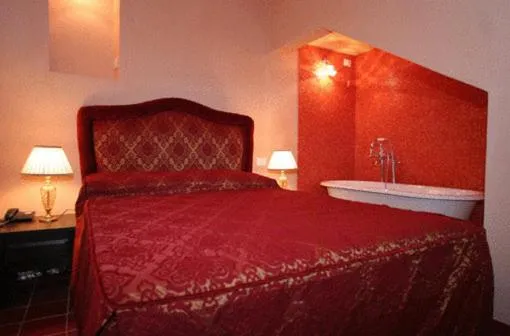 Bed in Grana Barocco Art Hotel