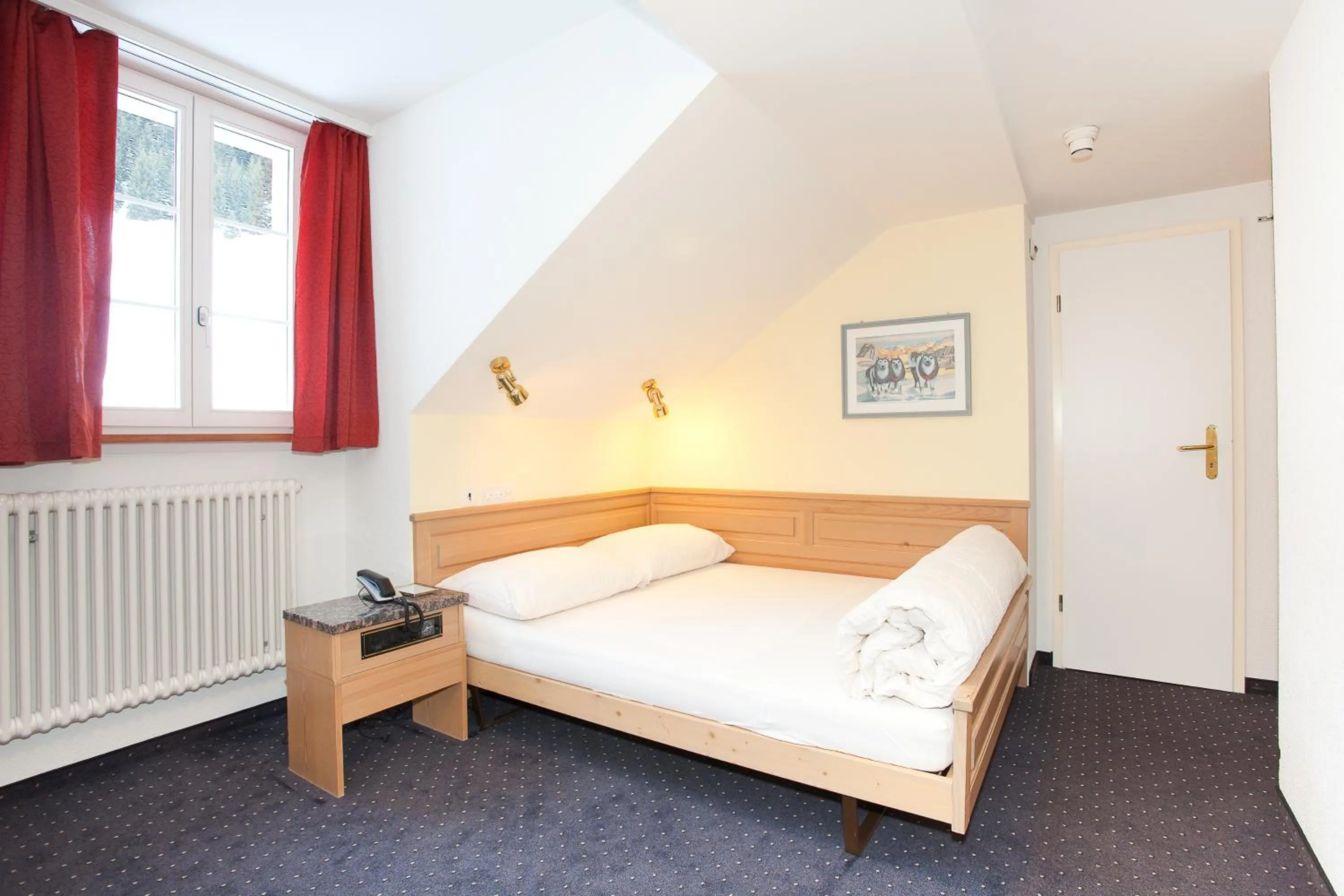 Bed in Hotel Jungfrau Mürren