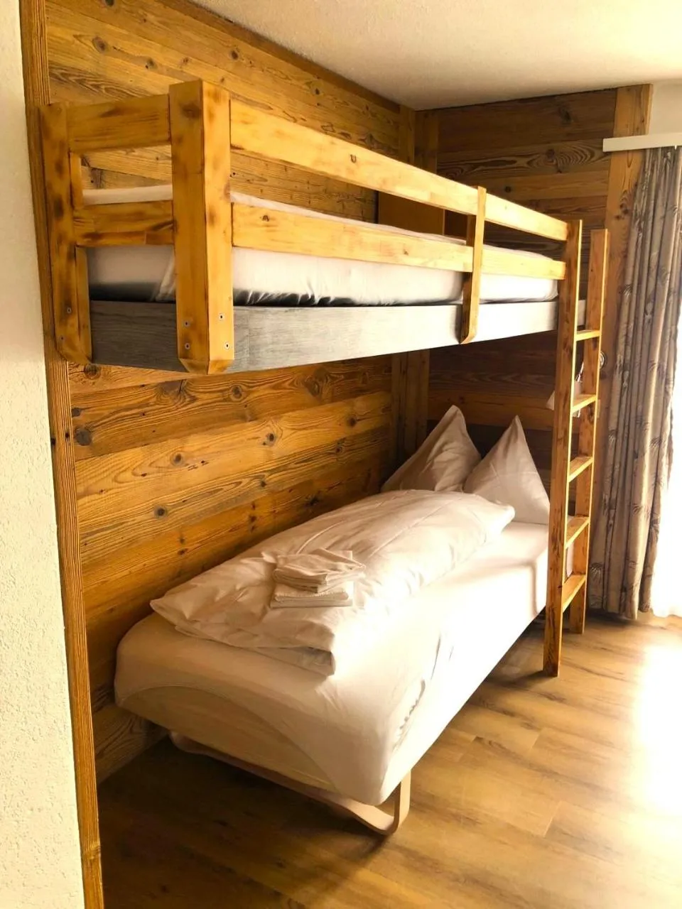 Bed in Hotel Christiania Saas-Fee