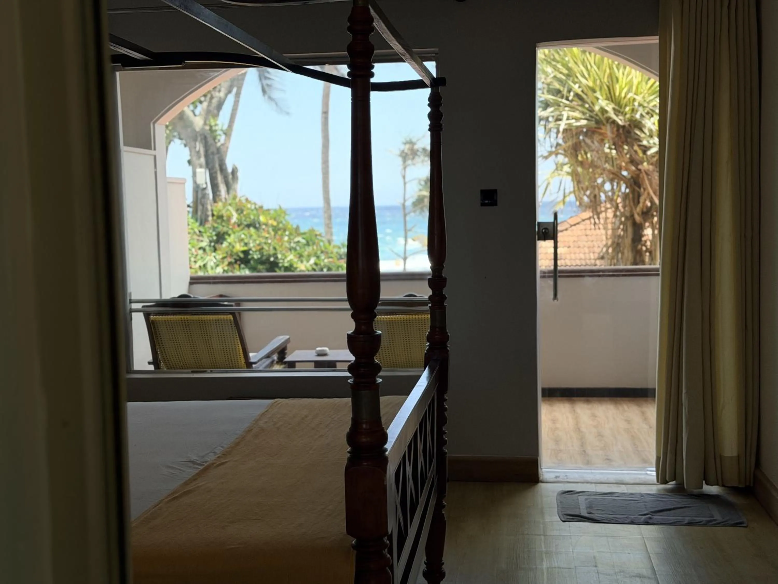 Balcony/Terrace, Bed in Sri Gemunu Beach Resort