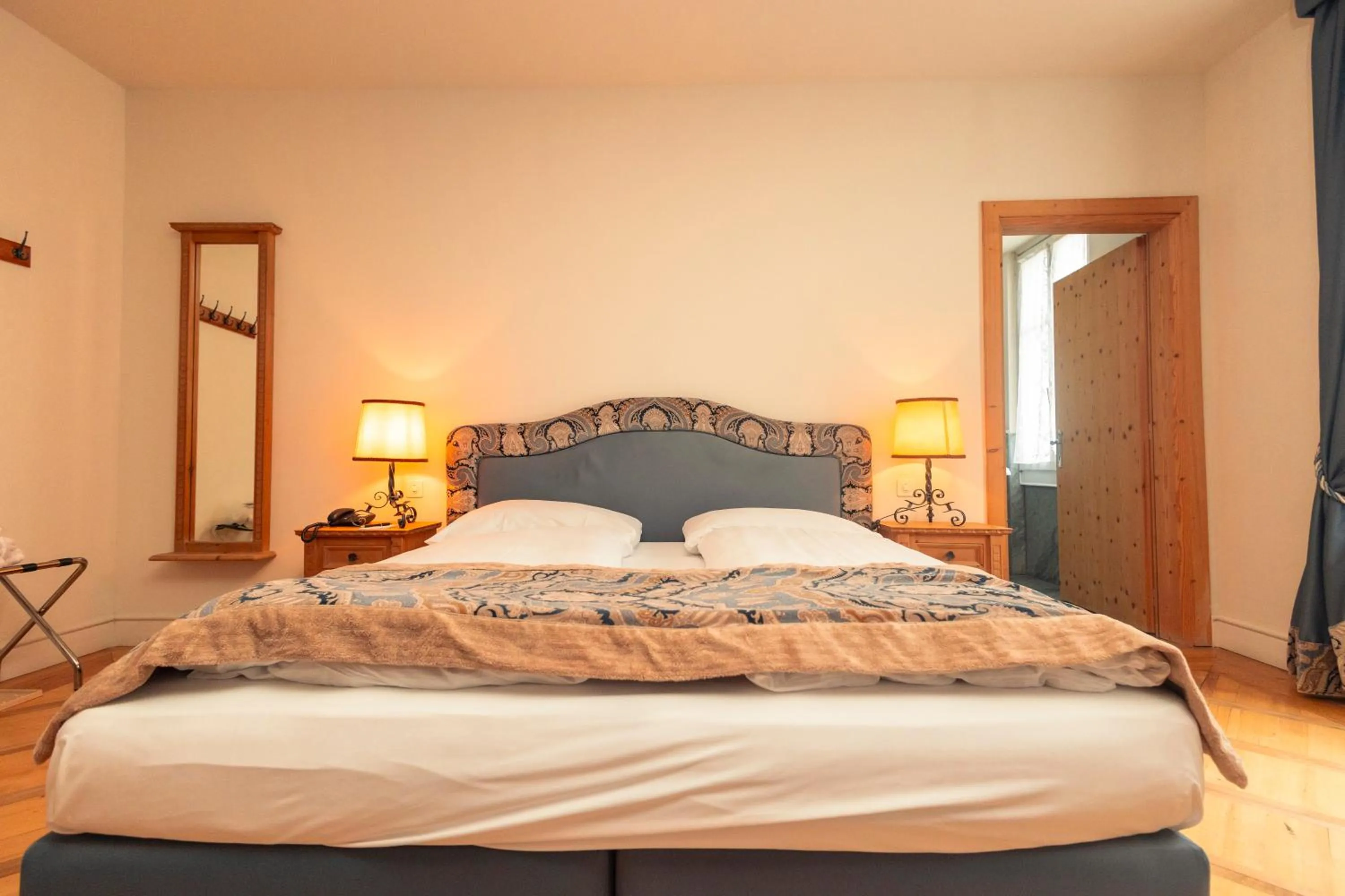 Bed in Hotel Bernina 1865 by Kleos Group Collection