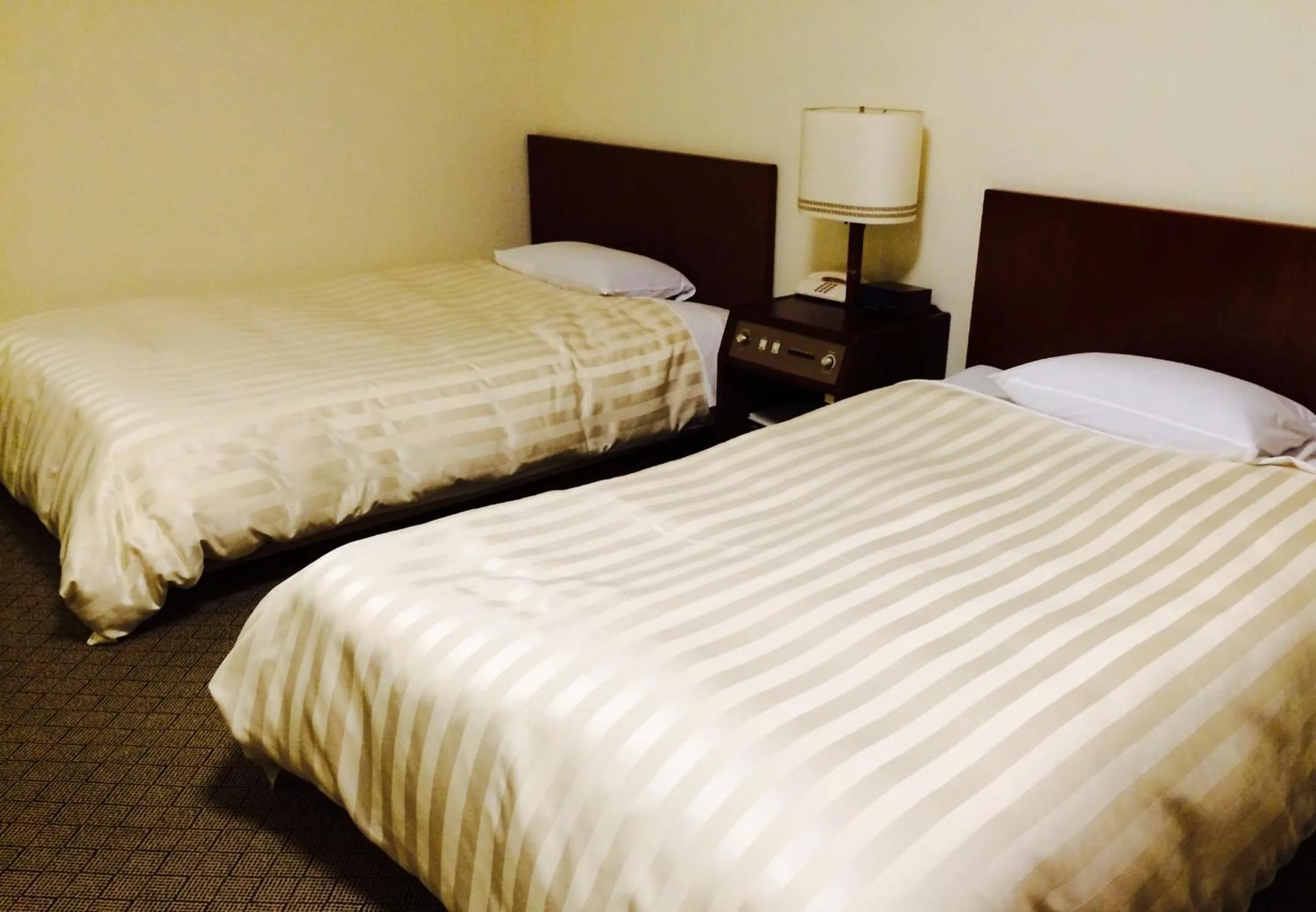 Bed in Hotel New Tanaka