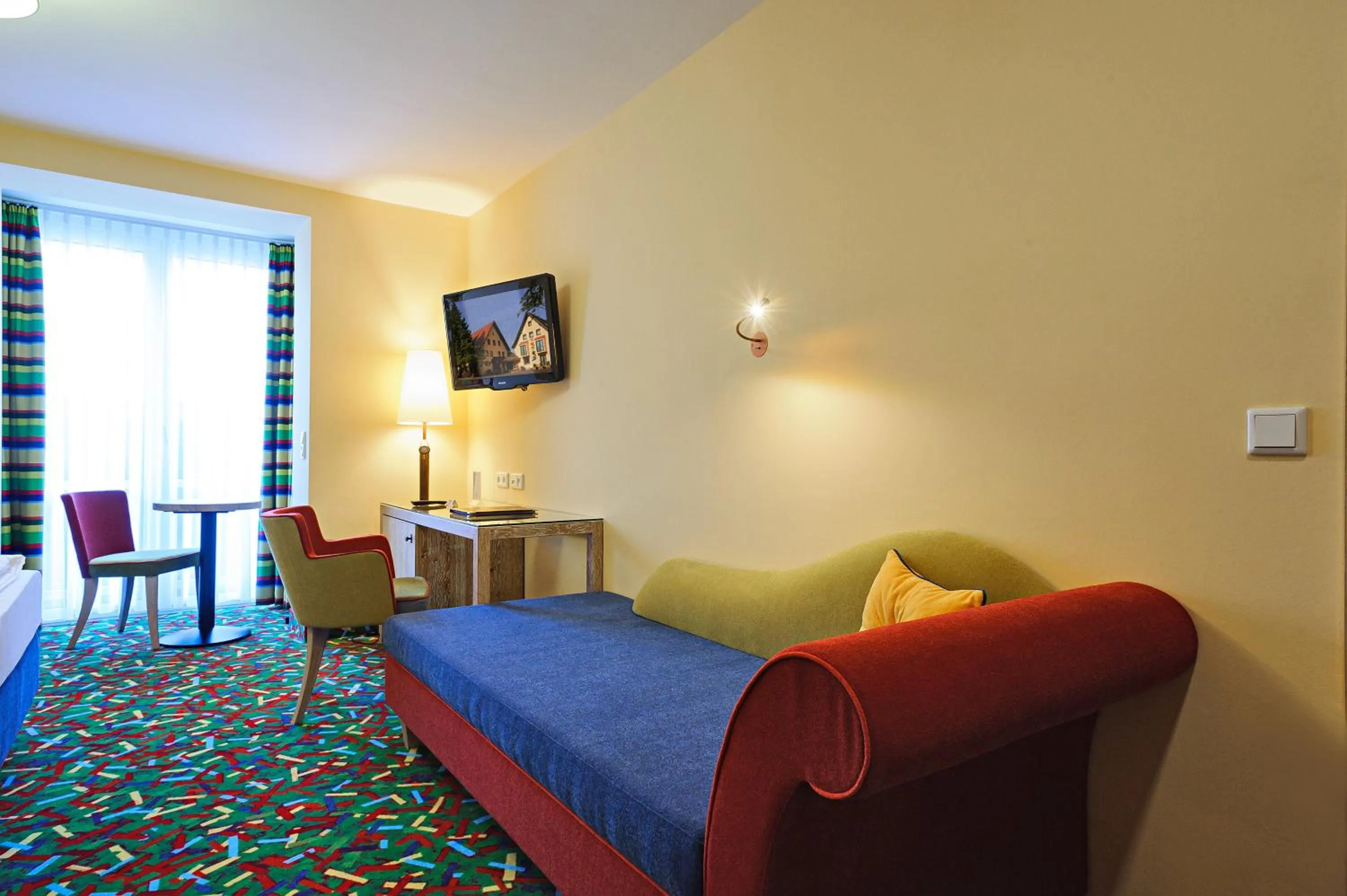 Seating area, Bed in Boutique Hotel Bundschuh 3 Sterne Superior