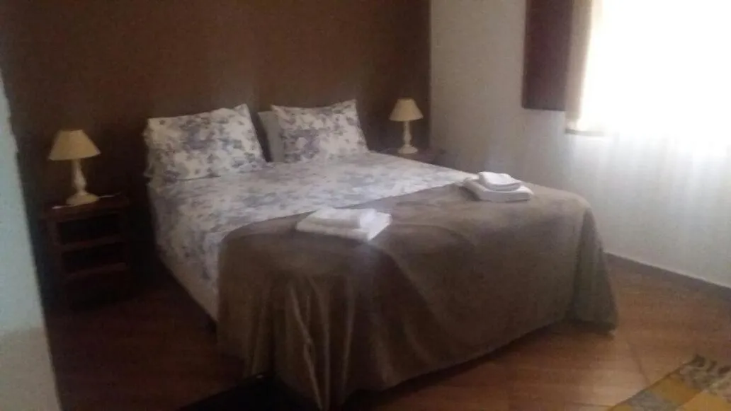 Bed in pousada canarinho