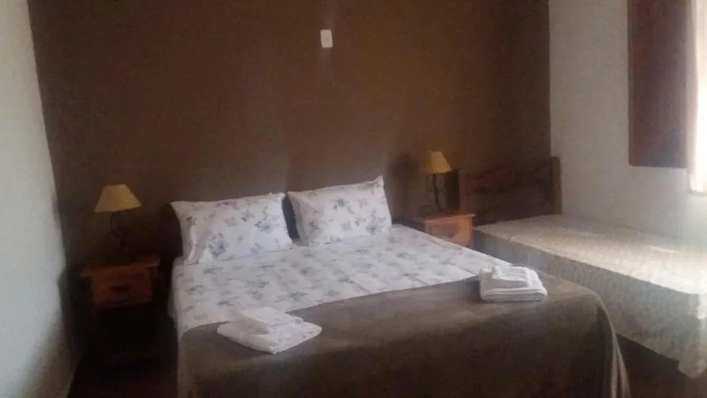 Bed in pousada canarinho