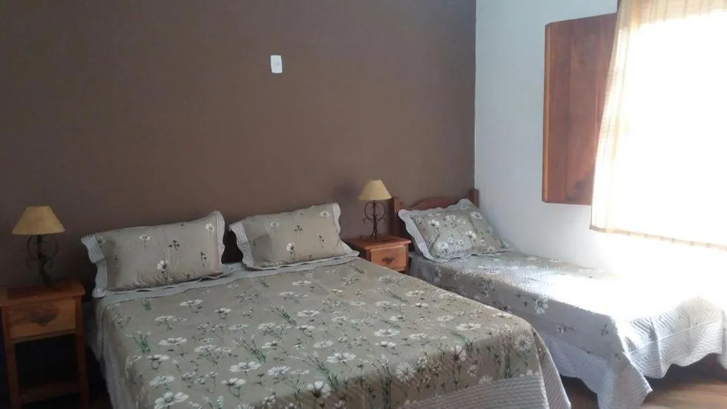 Bed in pousada canarinho
