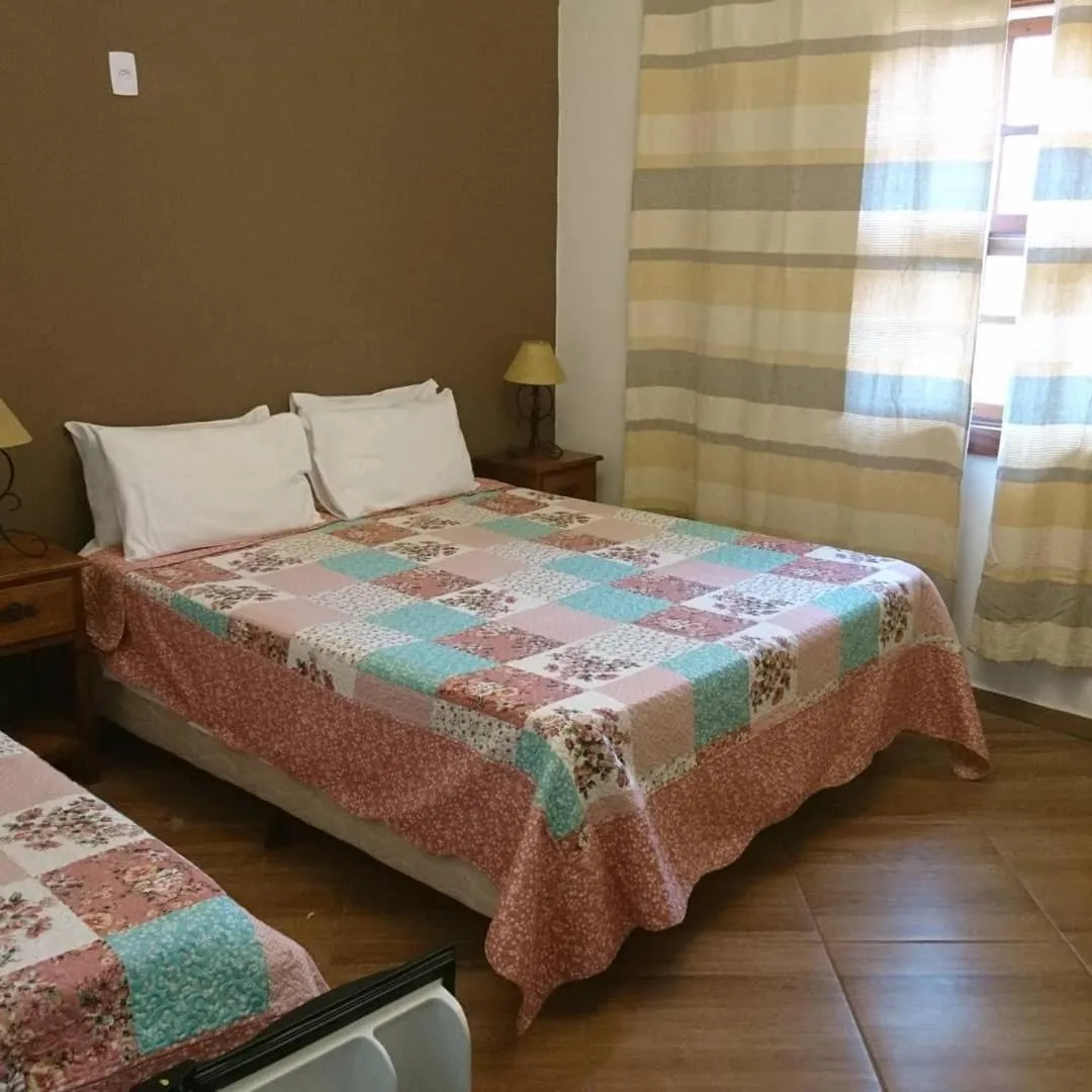 Bed in pousada canarinho