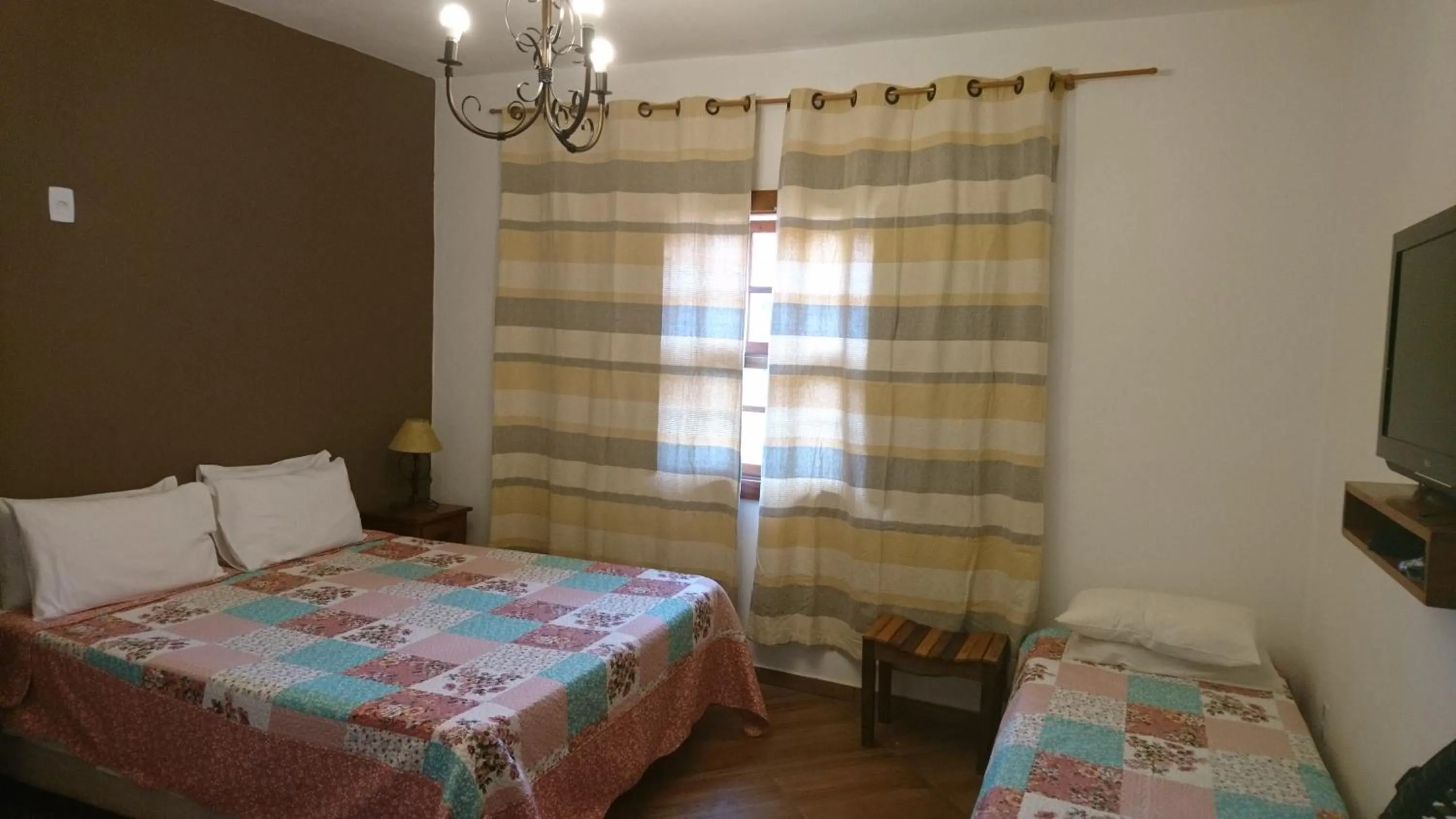 Bed in pousada canarinho