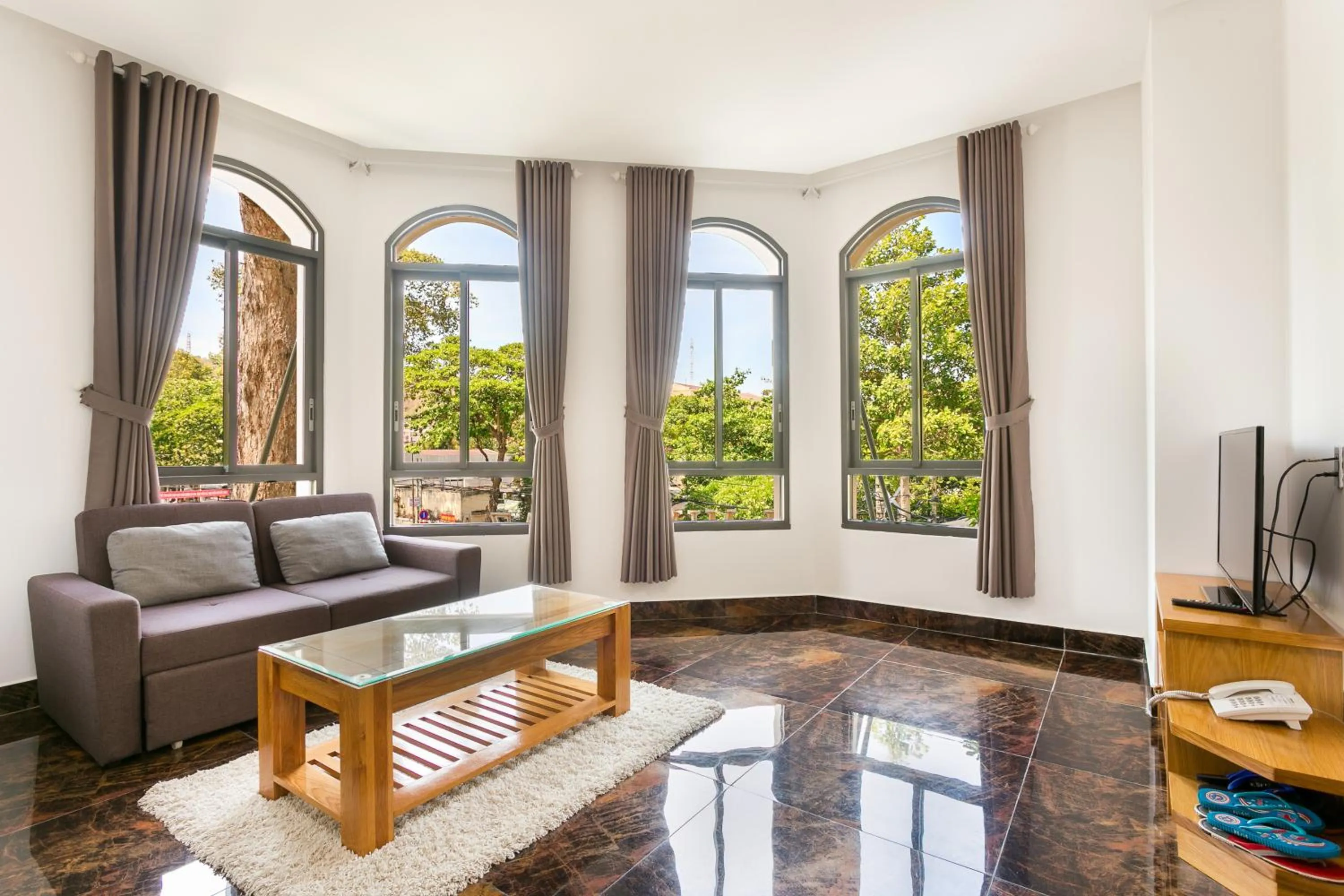 Communal lounge/ TV room in Kim Minh Apartment & Hotel