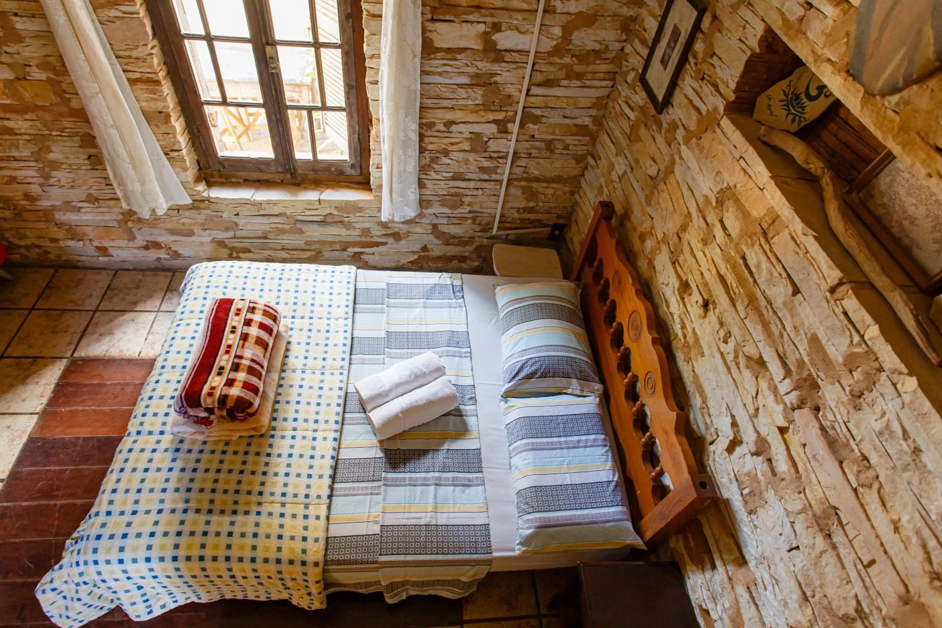 Bed in Chalé de Pedra - Hospedaria