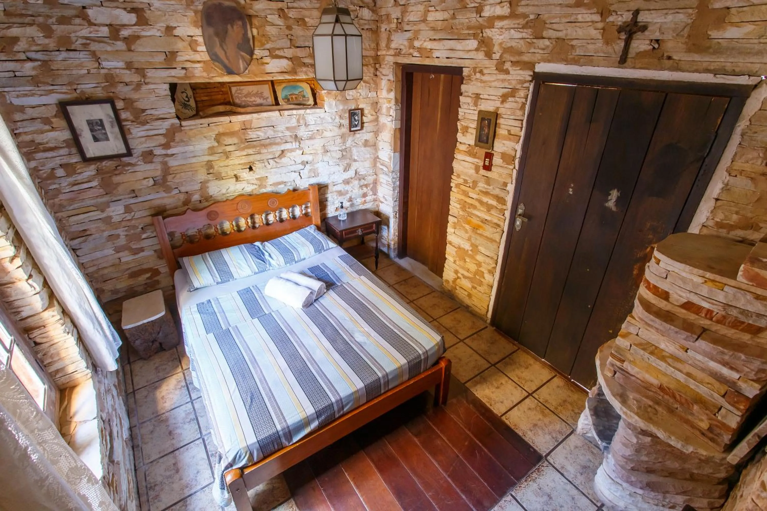 Bed in Chalé de Pedra - Hospedaria