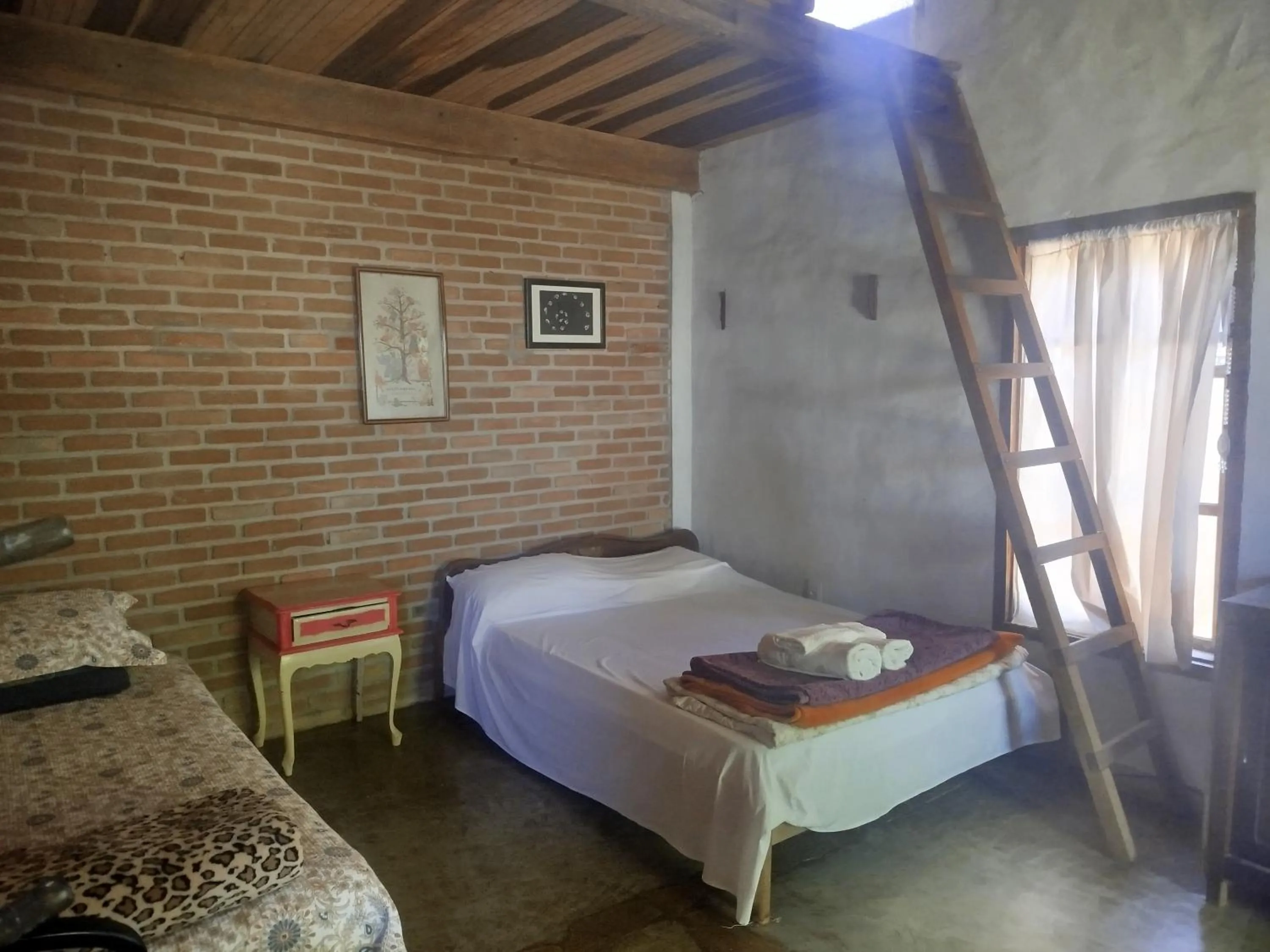 Bed in Chalé de Pedra - Hospedaria